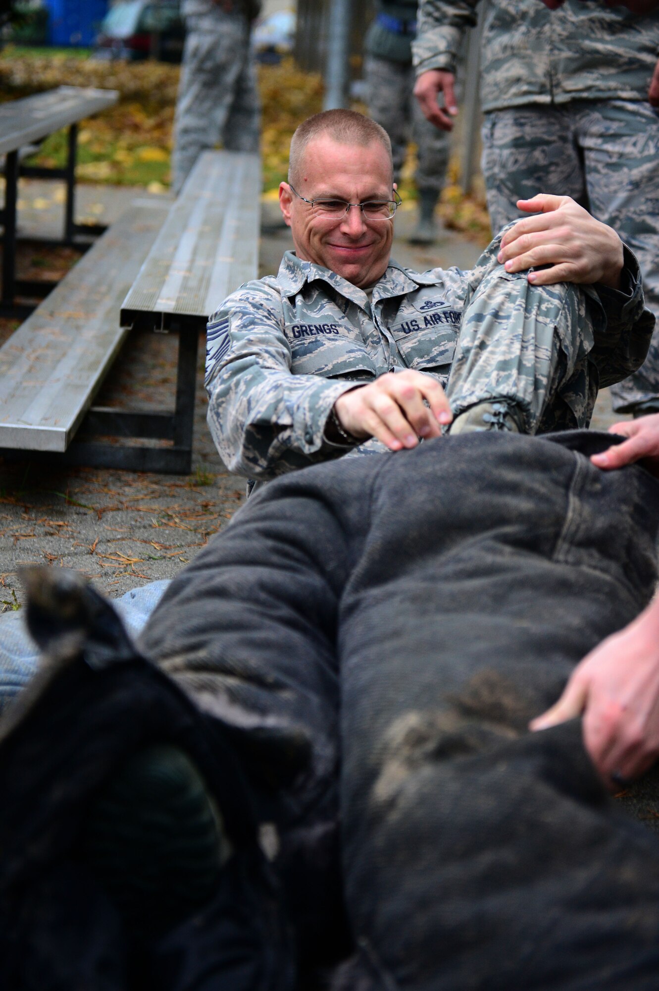 SPANGDAHLEM AIR BASE, Germany – U.S. Air Force Chief Master Sgt. Matthew Grengs, 52nd Fighter Wing command chief from Longmont, Colo. puts on a padded suit before a K-9 unit demonstration at the military working dog kennel Oct. 15, 2012.  These dogs, along with their handlers, are deployed worldwide to support the war on terror and safeguard military bases by detecting bombs, drugs and other illegal substances. (U.S. Air Force photo by Airman 1st Class Gustavo Castillo/Released)