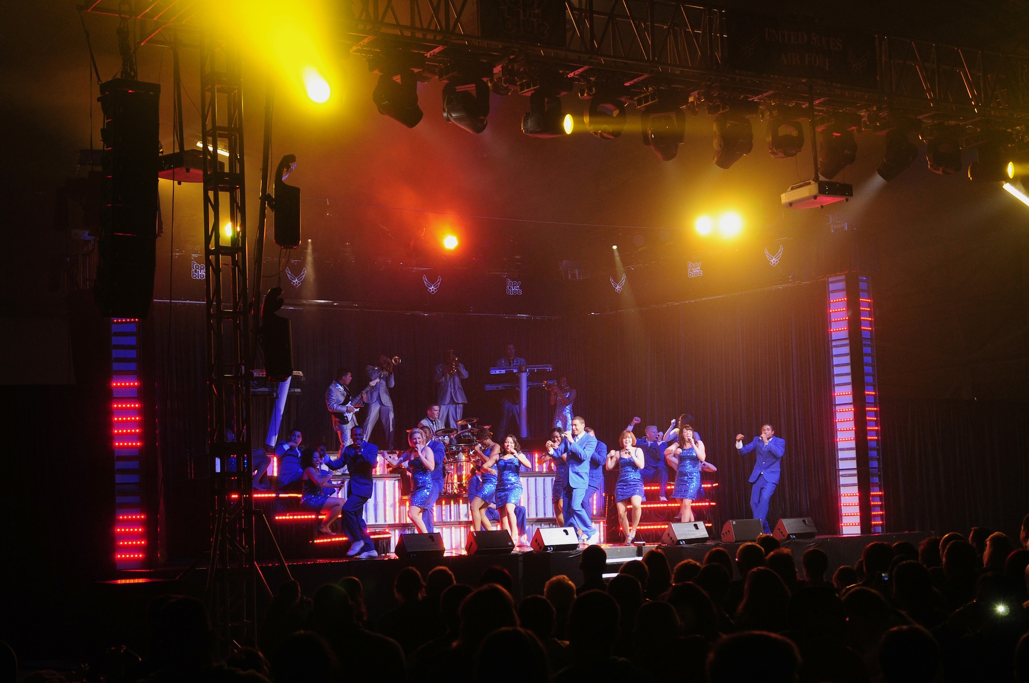 ROYAL AIR FORCE LAKENHEATH, England – Members of Tops In Blue perform at Hangar 7 Oct. 11, 2012. The Tops In Blue 2012 World Tour, entitled “Listen,” features songs by Whitney Houston, Maroon 5, Carrie Underwood, Lady Antebellum and many others. Tops In Blue tours every year visiting stateside bases and overseas locations providing entertainment for Airmen, families and members of the local community.  (U.S. Air Force photo by Airman 1st Class Cory D. Payne)