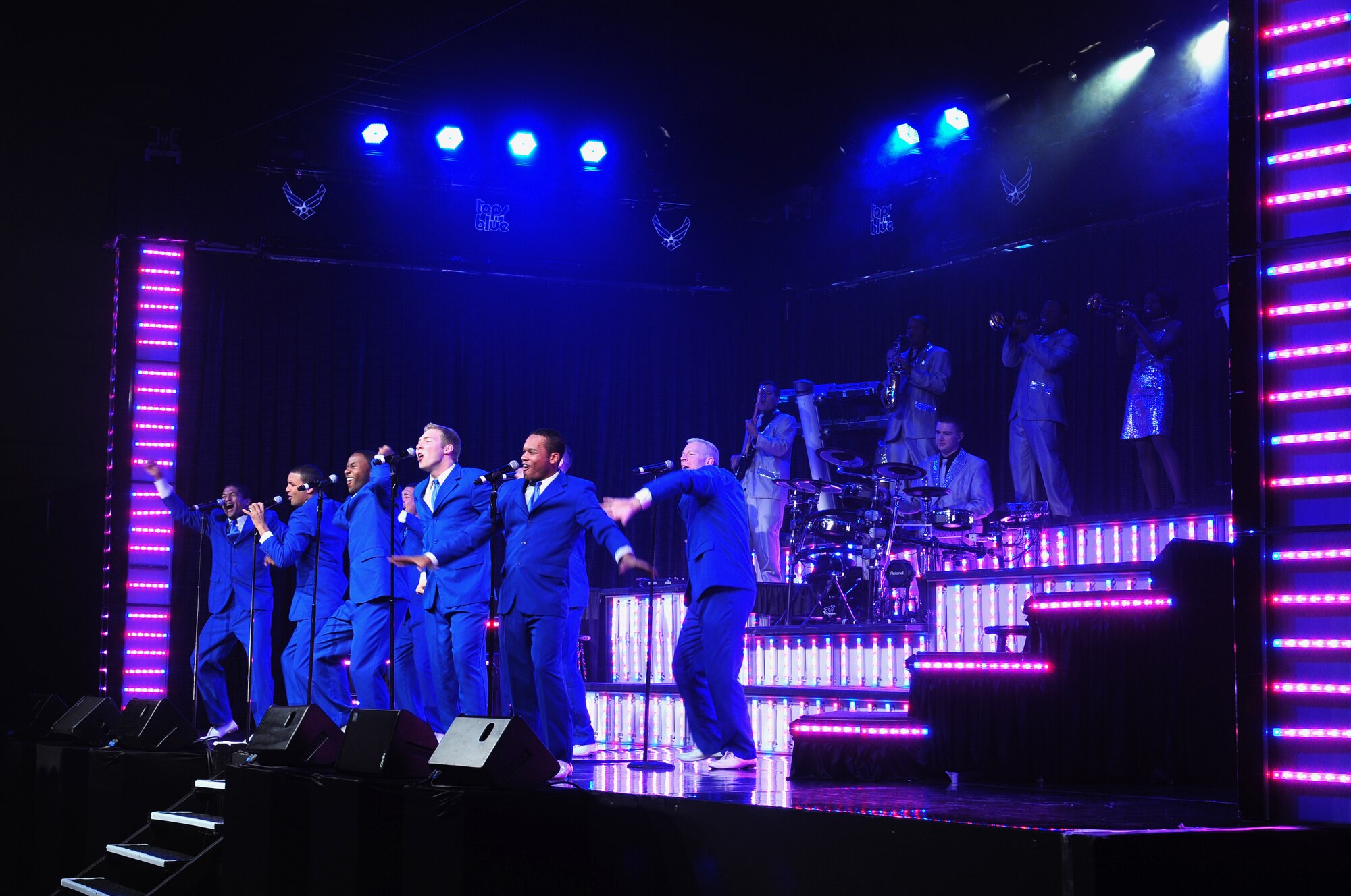 ROYAL AIR FORCE LAKENHEATH, England – Members of Tops In Blue perform at Hangar 7 Oct. 11, 2012. The Tops In Blue 2012 World Tour, entitled “Listen,” features songs by Whitney Houston, Maroon 5, Carrie Underwood, Lady Antebellum and many others. Tops In Blue tours every year visiting stateside bases and overseas locations providing entertainment for Airmen, families and members of the local community.  (U.S. Air Force photo by Airman 1st Class Cory D. Payne)