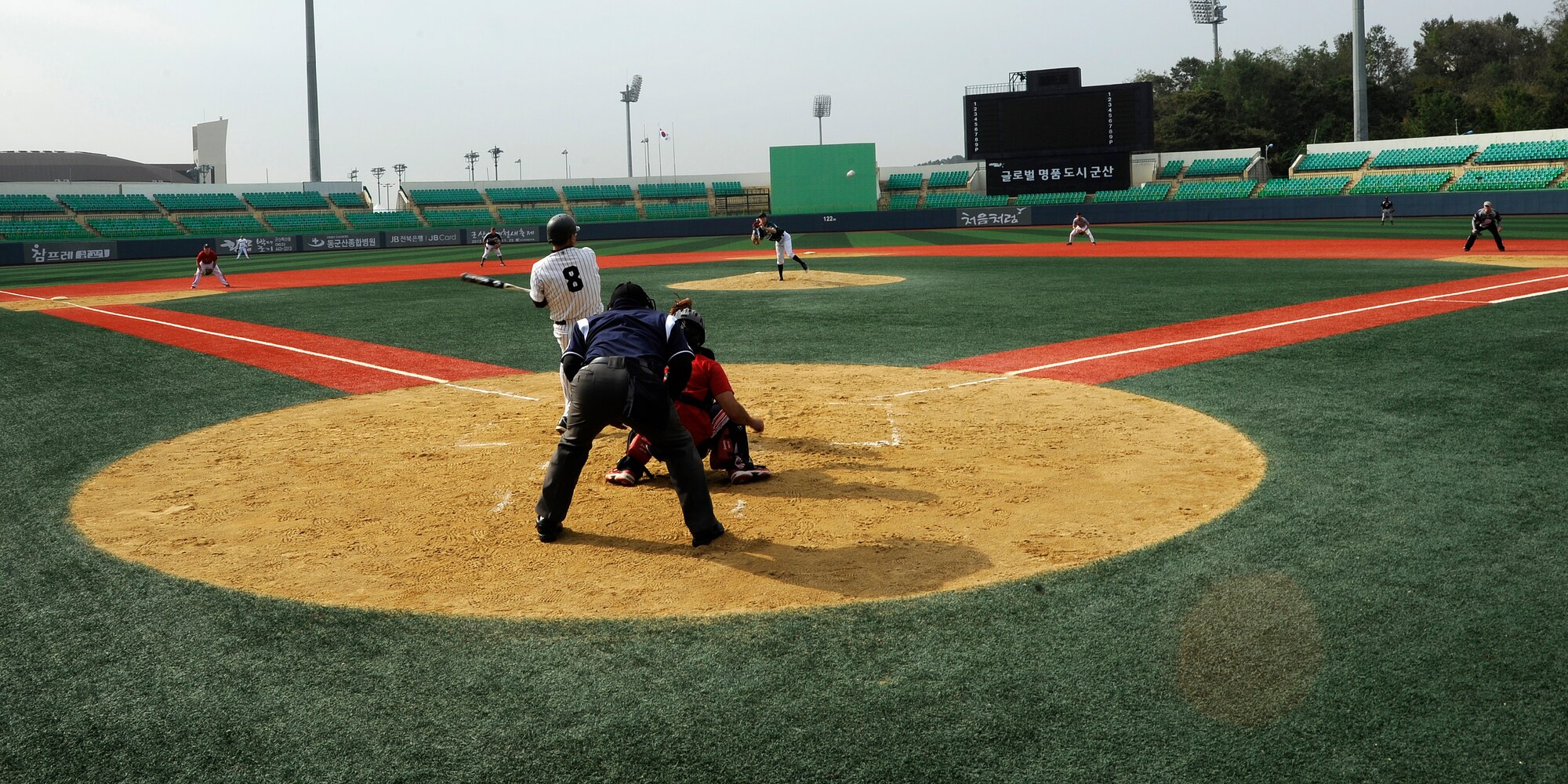 Senior Airman Cody Green, 8th Fighter Wing command post, pitches the ball to a member of the local Gunsan team ‘The Law’ at Gunsan City Sports Stadium, Republic of Korea, Oct. 13, 2012. Green struck out many of ‘The Law’ during the game preventing them from scoring more than 6 runs. (U.S. Air Force photo/Senior Airman Marcus Morris)