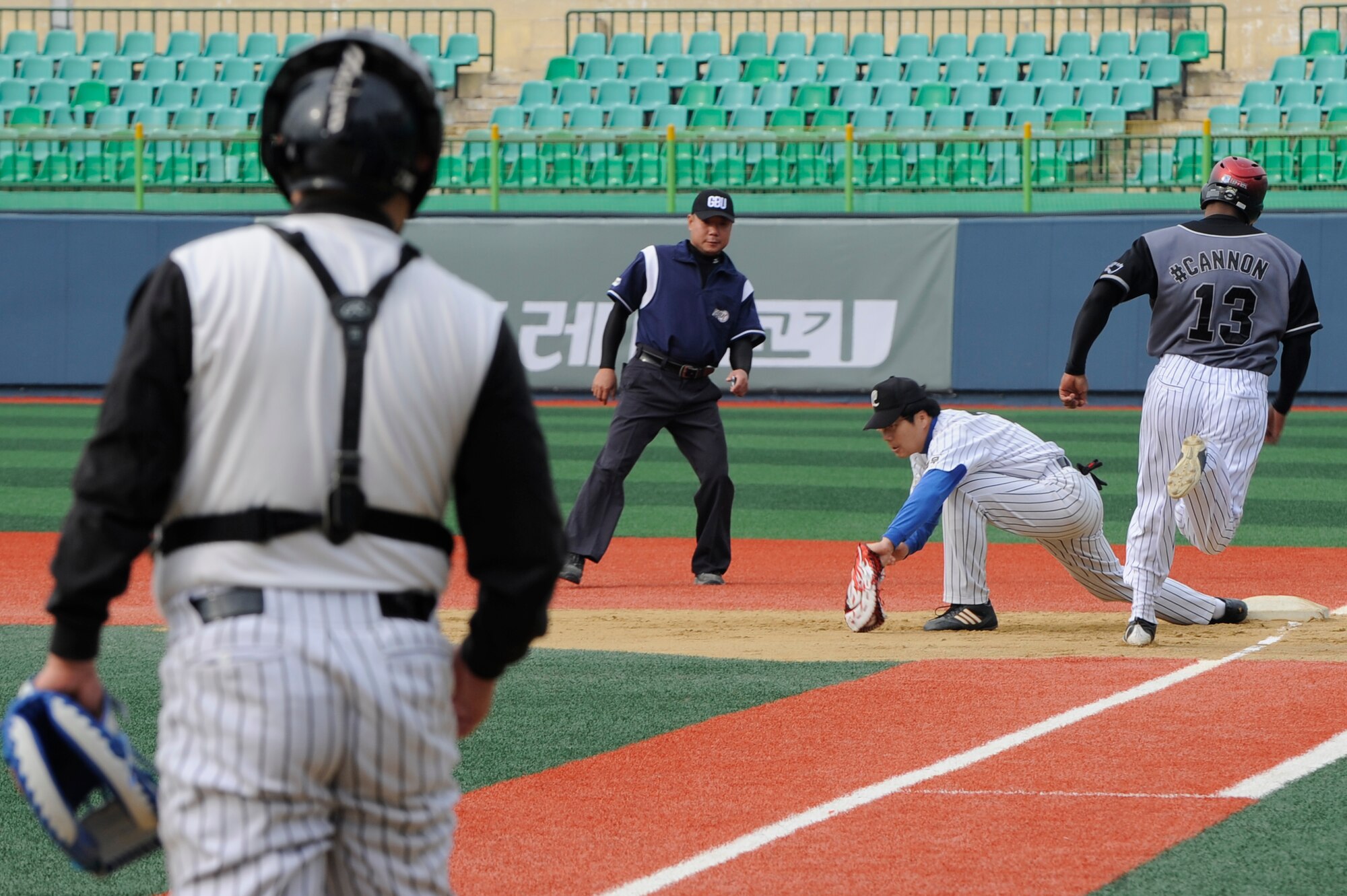 Tech. Sgt. Lavell Williams, 8th Fighter Wing command post, sprints to first base during a baseball game between service members from Kunsan Air Base, Republic of Korea and local Gunsan team called ‘The Law’ at Gunsan City Sports Stadium, Republic of Korea, Oct. 13, 2012. As captain of the U.S. baseball team, Williams coordinated logistics, assembled the team, and ultimately secured a win for the base team. (U.S. Air Force photo/Senior Airman Marcus Morris)