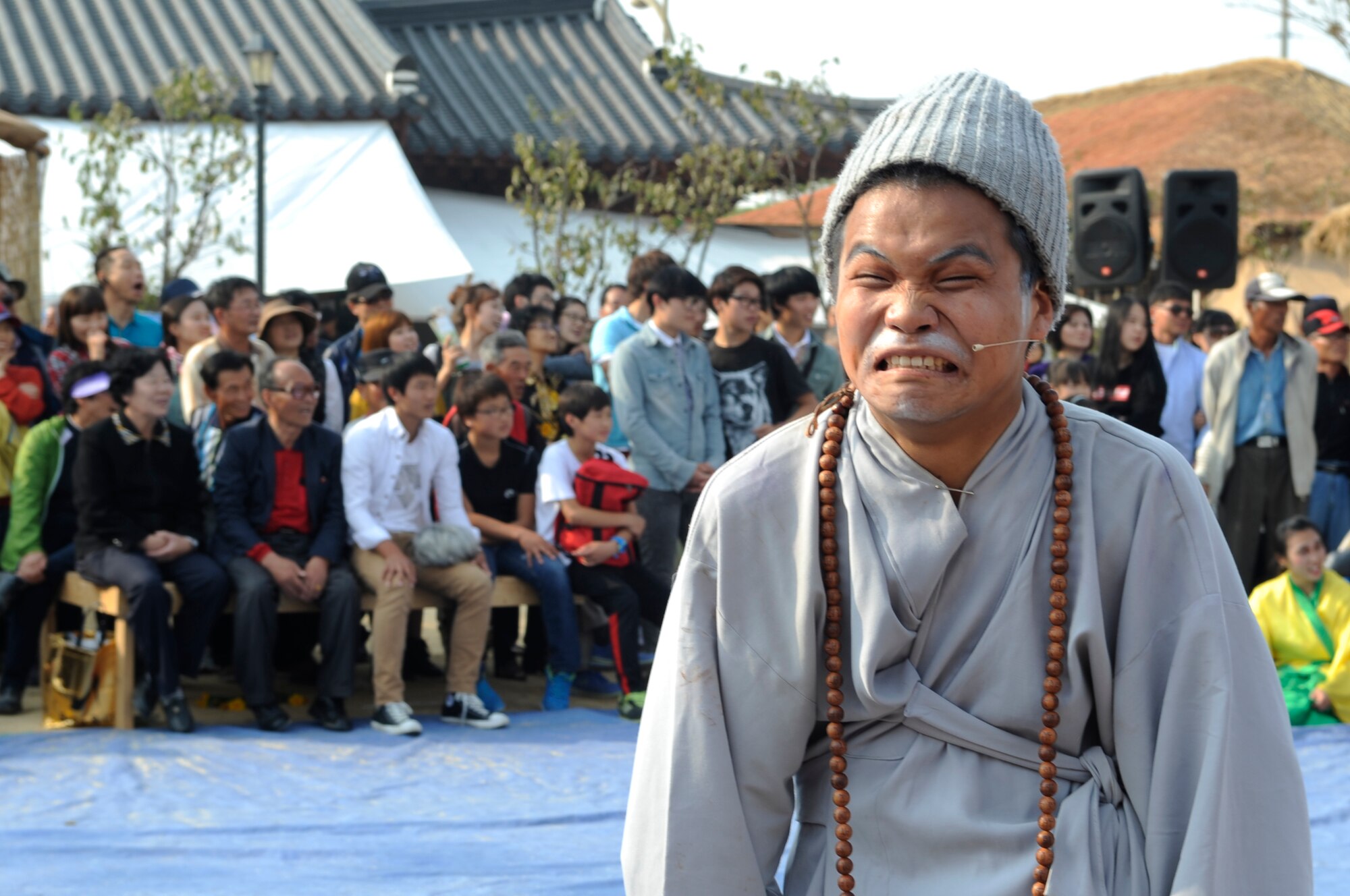 An actor at the Gimje Horizon Festival performs a comedic skit for the crowd Oct. 14, 2012, in Gimje, South Korea. About 60 Wolf Pack members traveled to the festival to learn more about South Korean culture and agriculture. (U.S. Air Force photo/Senior Airman Brigitte N. Brantley)