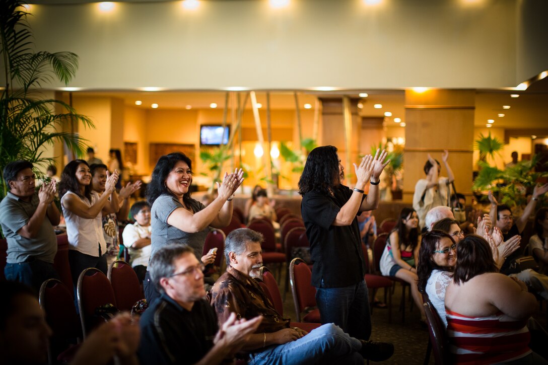 TUMON BAY, Guam -- Audience members clap, cheer, and give Pacifc Trends, Band of the Pacific-Asia popular music ensemble, a standing ovation after the last song is played at the Outrigger Hotel, Tumon Bay, Guam, on Oct. 14, 2012. After the performance, hotel guests came and thanked the band for a performance that "sounded great." (U.S. Air Force photo/Staff Sgt. Josh Voyles)