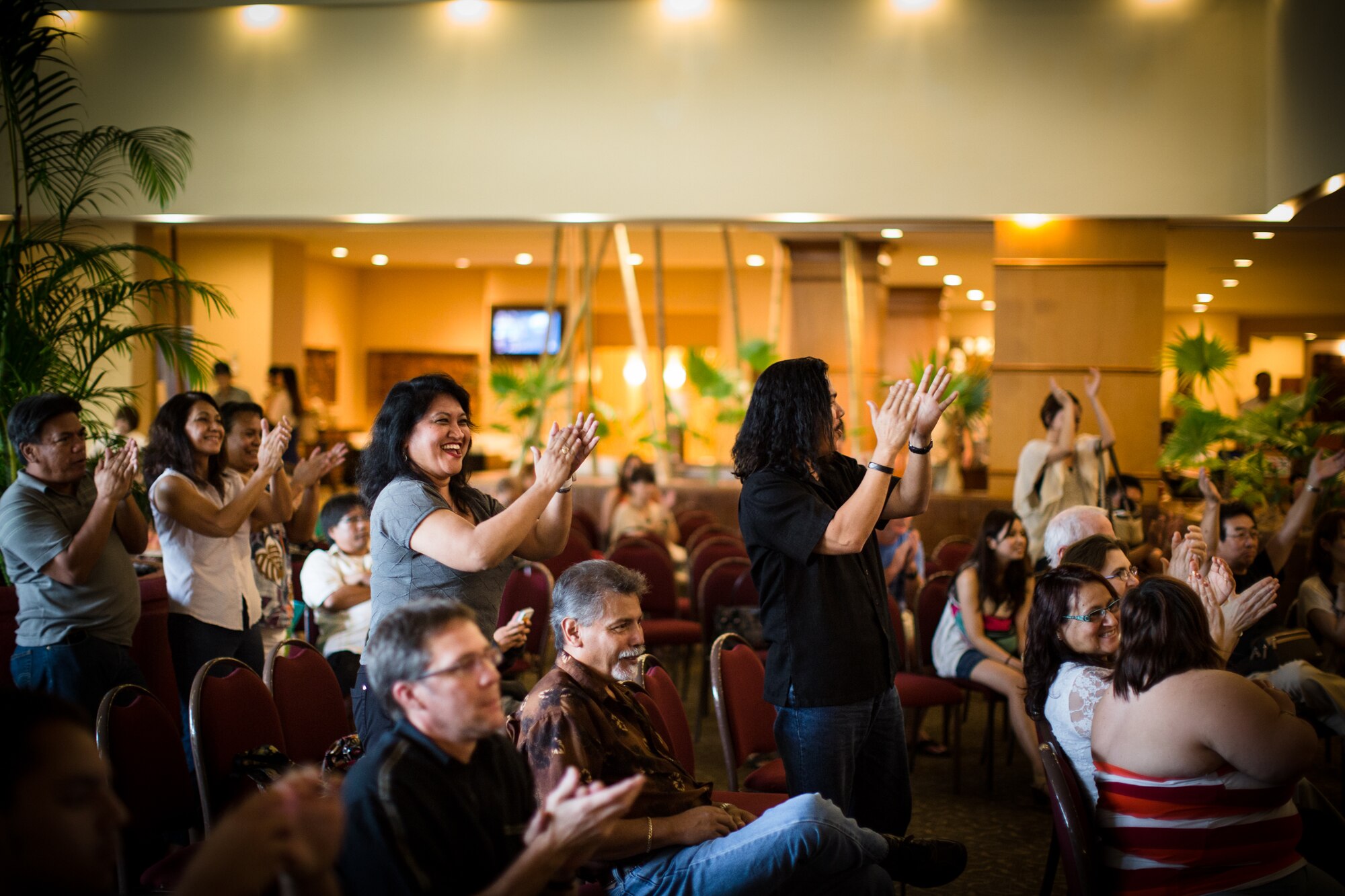 TUMON BAY, Guam -- Audience members clap, cheer, and give Pacifc Trends, Band of the Pacific-Asia popular music ensemble, a standing ovation after the last song is played at the Outrigger Hotel, Tumon Bay, Guam, on Oct. 14, 2012. After the performance, hotel guests came and thanked the band for a performance that "sounded great." (U.S. Air Force photo/Staff Sgt. Josh Voyles)