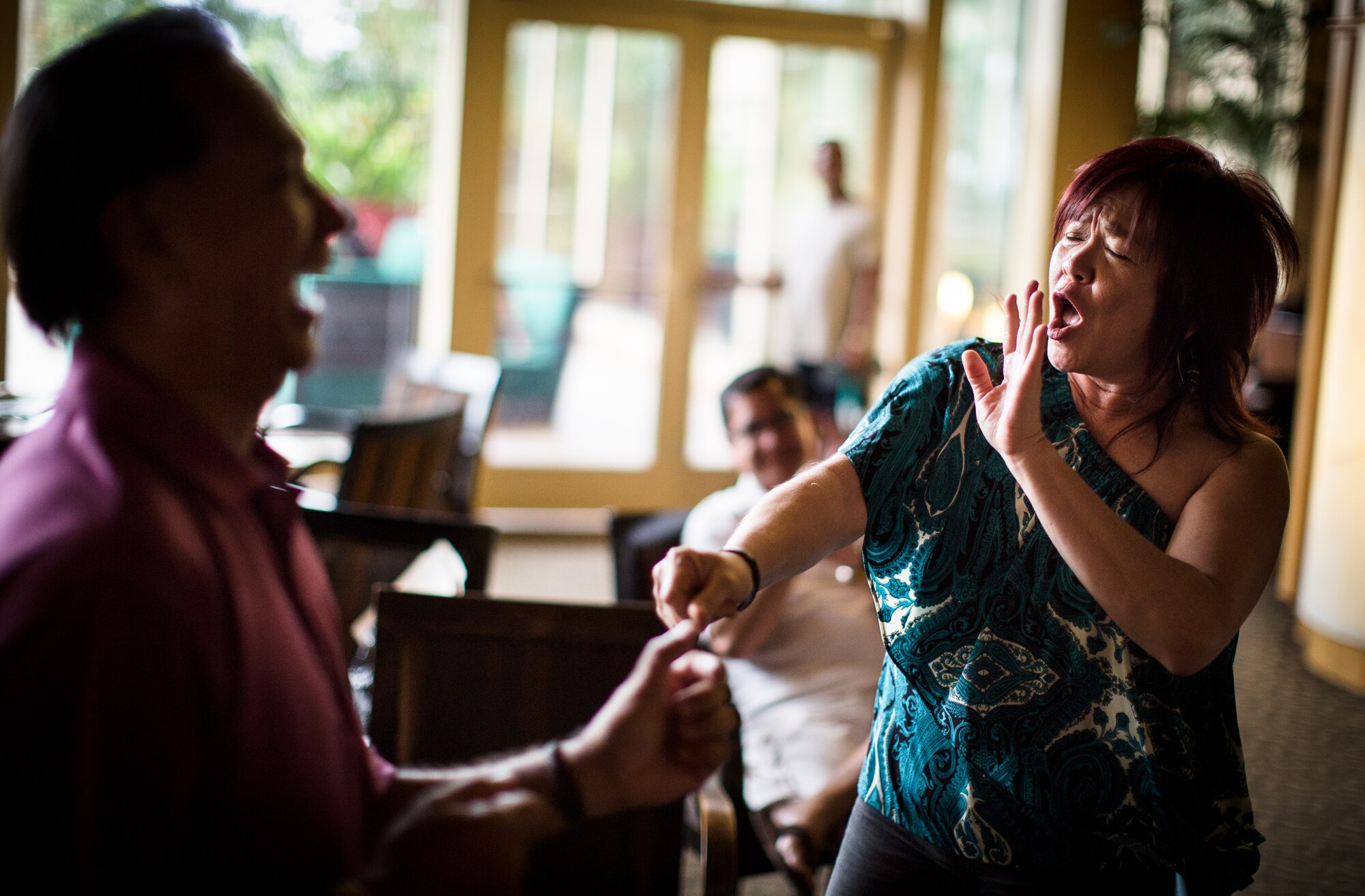 TUMON BAY, Guam -- Two audience members dance during the song "Love Shack" performed by Pacific Trends, Band of the Pacific-Asia popular music ensenmble, at the Outrigger Hotel, Tumon Bay, Guam, on Oct. 14, 2012. Many audience members danced and sang while encouraging others to do the same. (U.S. Air Force photo/Staff Sgt. Josh Voyles)