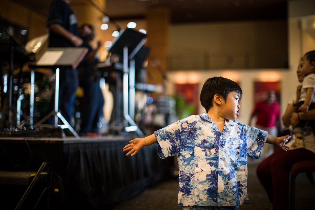 TUMON BAY, Guam -- A young Japanese boy dances to live music at the Outrigger Hotel, Tumon Bay, Guam, on Oct. 14, 2012. Pacific Trends, Band of the Pacific-Asia popular music ensemble, played for an audience consisting of a variety of nationalities including American, Japanese, Filipino, Australian, British and others visiting the island. (U.S. Air Force photo/Staff Sgt. Josh Voyles)