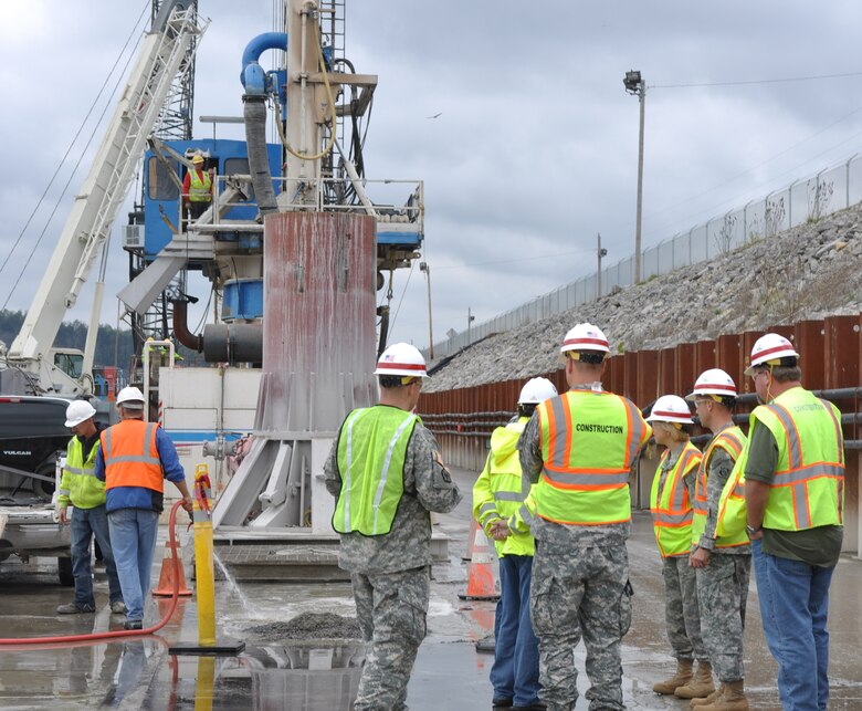 Brig. Gen. Margaret W. Burcham, Great Lakes and Ohio River Division commander, views project operations from the barrier wall platform during her first visit to the Wolf Creek Foundation Remediation Project on Oct. 10, 2012. (USACE photo by Amy Redmond)