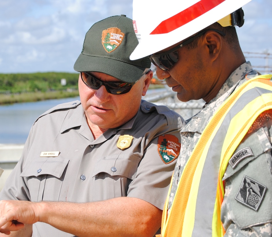 Dave Sikkema (left),project manager for Everglades National Park and Dan Kimball (center), superintendant of Everglades National Park, provide Lt. Gen. Thomas P. Bostick, commanding general of the U.S. Army Corps of Engineers (right), with an overview of the benefits of the Tamiami Trial Bridge Modifications project Oct. 10, 2012.
