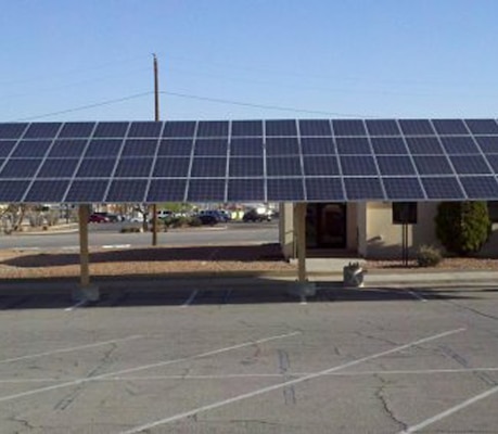 This carport at Fort Hood, Texas, not only helps keep cars cool from the scorching Texas sun, it also generates solar power to keep the buildings cool on the inside and reduce the energy bills throughout the military facility.