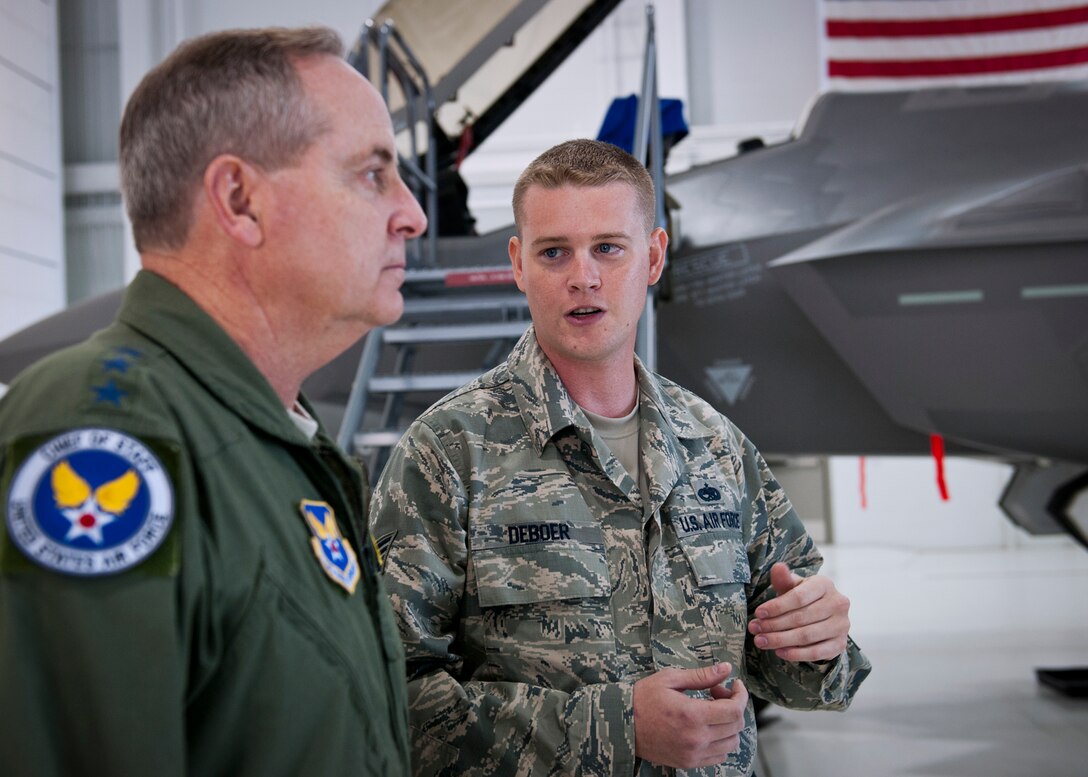 Staff Sgt. Skyler Deboer, of the 33rd Aircraft Maintenance Squadron, briefs Air Force Chief of Staff Gen. Mark A. Welsh III on the F-35A Lightning II during the general’s visit to the 33rd Fighter Wing at Eglin Air Force Base, Fla., Oct. 16. During an immersion at the integrated training center for the fifth generation aircraft, Gen. Welsh said he considers the joint strike fighter mission and its future one of his top priorities so he wanted to see the operation and training firsthand. The 33rd Fighter Wing's unique environment is comprised of military, civilians and contractors at Eglin, who will train pilots and maintainers for all three variants of the F-35 for the Air Force, Navy and Marines. (U.S. Air Force photo/Samuel King Jr.)