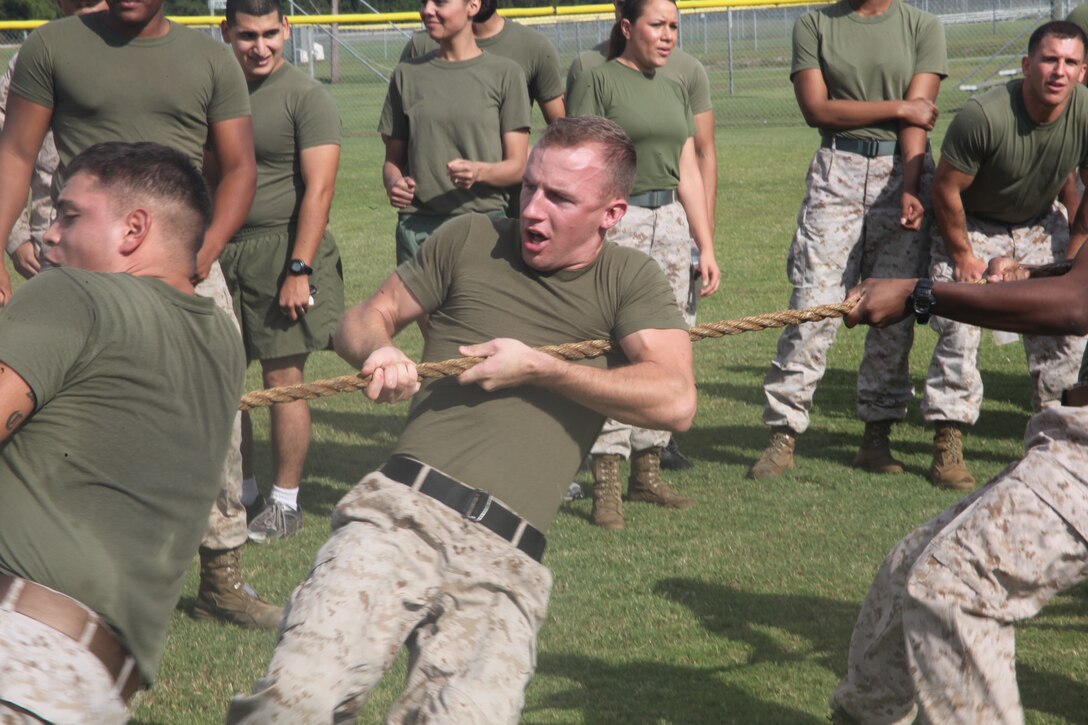 Lance Cpl. Chris R. Skelton, a member of the Headquarters & Headquarters Squadron Tug-of-War team, fights hard to win the first of the best-of-three match-up during the H&HS V.S. Marine Wing Headquarters Squadron 2 Field Meet at the Air Station Sports Complex Oct. 5. MWHS-2 won the Tug-of-War competition but lost overall as H&HS retained the H&HS/MWHS-2 Field Meet Commander's Trophy with a final score of 18-12.