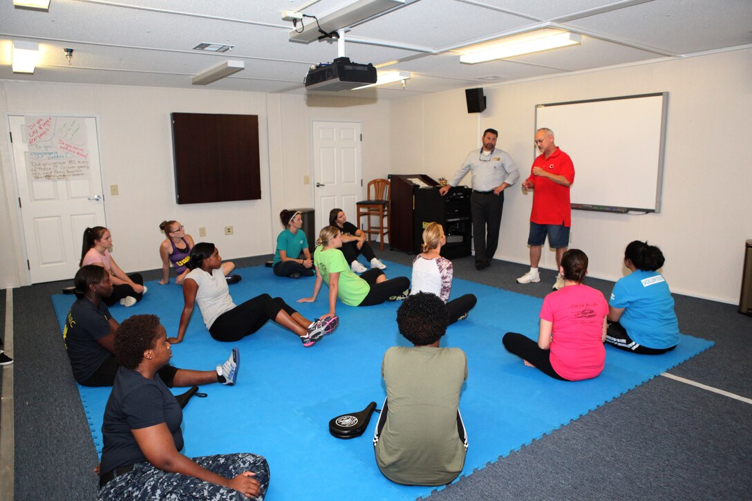 Patrick Ashton, a local martial arts instructor, speaks to students of Marine Corps Family Team Building's Self-Defense 101 Oct. 3. Ashton focused on simple techniques that could be easily remembered in a pinch.