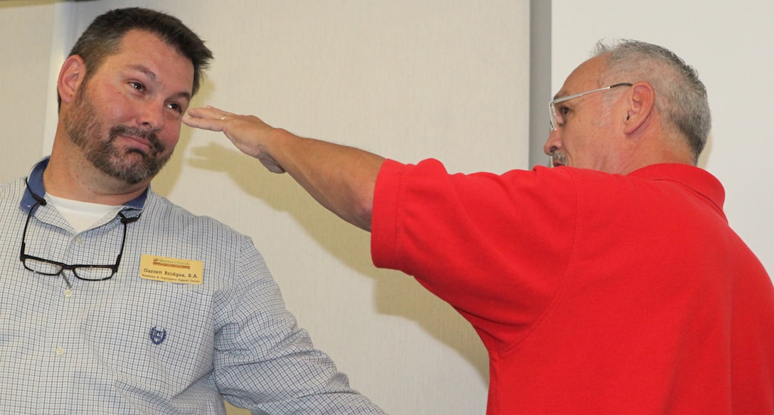 Patrick Ashton, a local martial arts instructor, demonstrates a technique during Marine Corps Family Team Building's Self-Defense 101 Oct. 3. Ashton wanted students to learn a few techniques that could save their lives in dangerous situations.