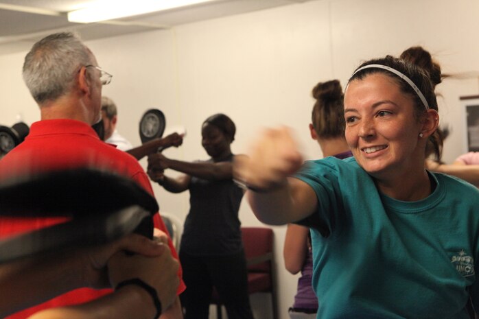 A student throws a punch during Marine Corps Family Team Building's Self-Defense 101 Oct. 3. Students learned various new techniques to defend themselves in potentially dangerous situations.