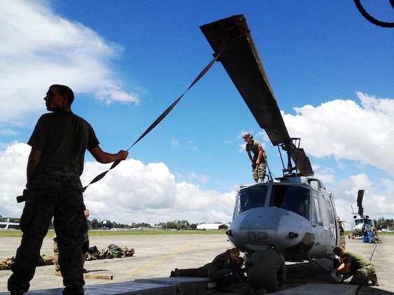 U.S. Marines with Detachment Martillo load a UH-1N "Huey" helicopter on an Air Force C-5 "Galaxy" at La Aurora International Airport in Guatemala City Oct. 12, en route back to the United States.  The task-organized detachment partnered with Guatemala authorities to disrupt illicit trafficking in the country’s coastal waters. With four Huey’s, Detachment Martillo flew over 250 detection and monitoring missions in support of Guatemalan law enforcement agencies and naval forces during the roughly two-month deployment.  "We saw an immediate impact in trafficking patterns along established routes after we started flying our helos," said Col. Rob Rauenhorst, the Detachment Martillo officer-in-charge.