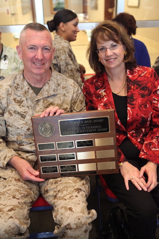 Lt. Gen. Steven A. Hummer, commander of Marine Forces Reserve, and his wife, Sheri Hummer, once a Marine herself, accept an award of behalf of MARFORRES presented by the local Molly Marine chapter of the Women Marines Association at Marine Corps Support Facility New Orleans, Oct. 15. 