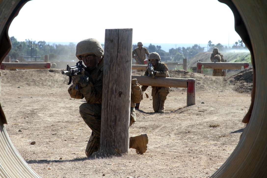 A recruit of Company A, 1st Recruit Training Battalion, posts security as the rest of his fire team moves through Howard's Assault course Oct. 11 aboard Marine Corps Base Camp Pendleton, Calif. The course simulaltes movement as a fire team and allows recruits to pratice communication skills. 
