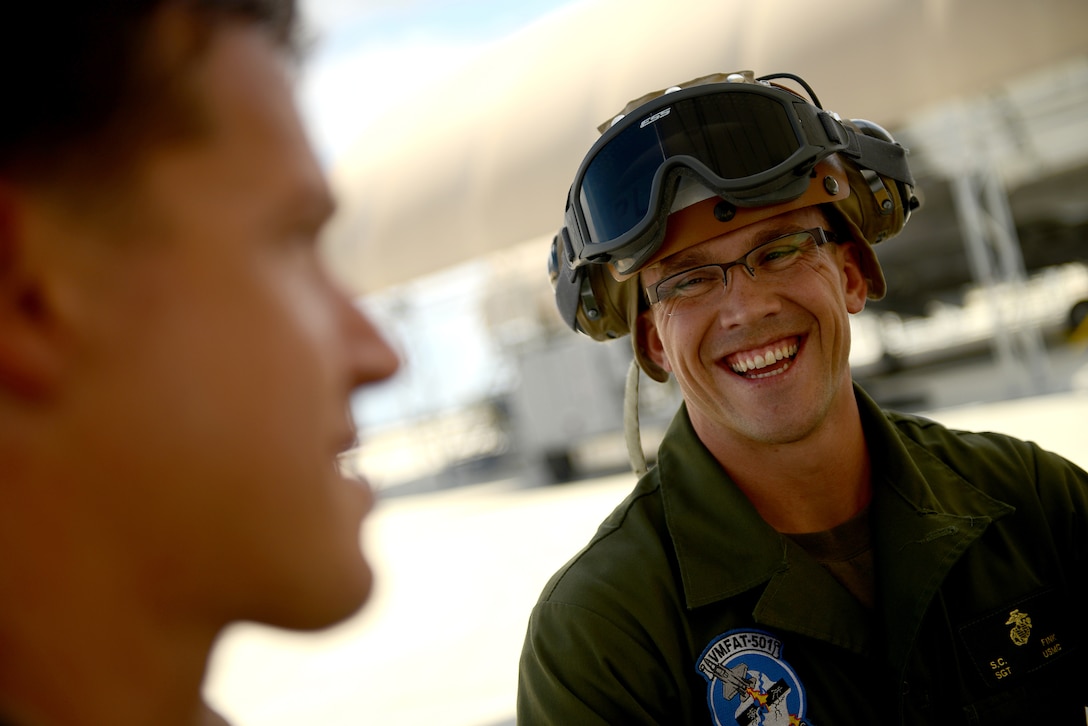 EGLIN AIR FORCE BASE, Fla. - F-35B Lightning II joint strike fighter Operations Officer and Pilot Maj. Adam Levine and Power line Mechanic Sgt. Stephen Fink from the Marine Fighter Attack Training Squadron 501, Eglin Air Force Base, Fla., talk about Levine's flight after conducting a local training mission over the Emerald Coast Sept. 18, 2012. 
