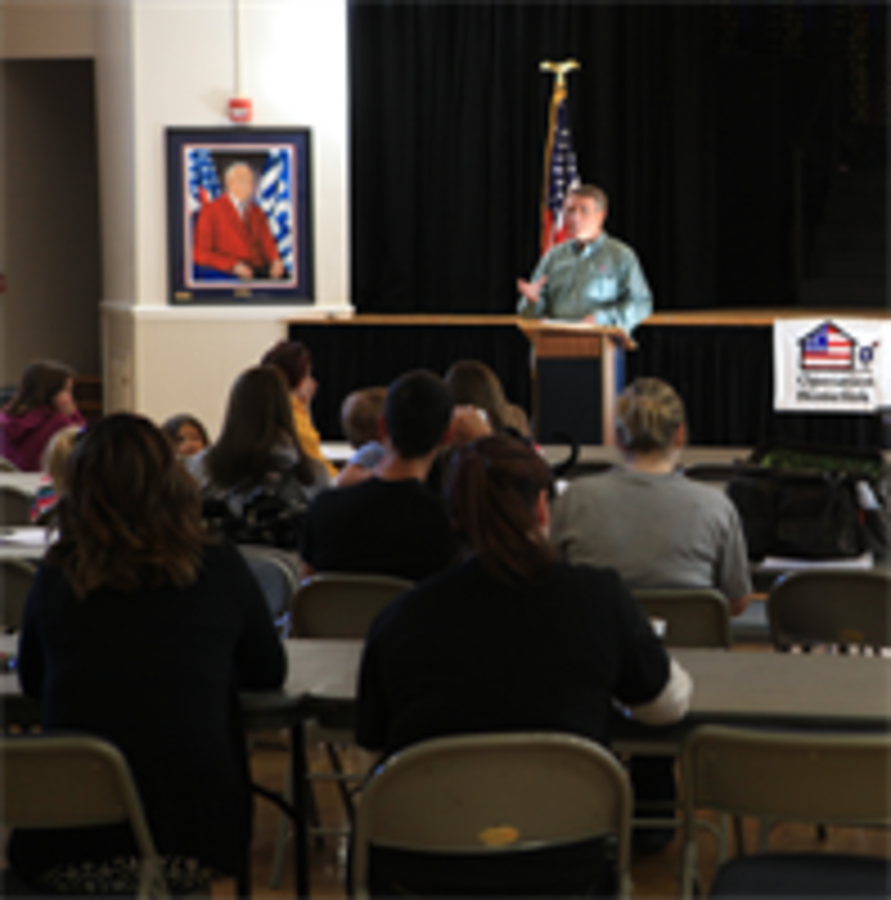 Dan Shannon, president and founder of Operation Homelink, gives a speech to the families of service members Saturday morning at the USO North Carolina Jacksonville. Before giving the families a laptop and webcam donated by supporting corporations, Shannon, explained why it was important for these families to communicate with their loved ones. Also he gave brief history of the organization and re-stated how much, the families and service members are appreciated for their sacrifices being made on behalf of the 99 percent of Americans who aren’t serving.