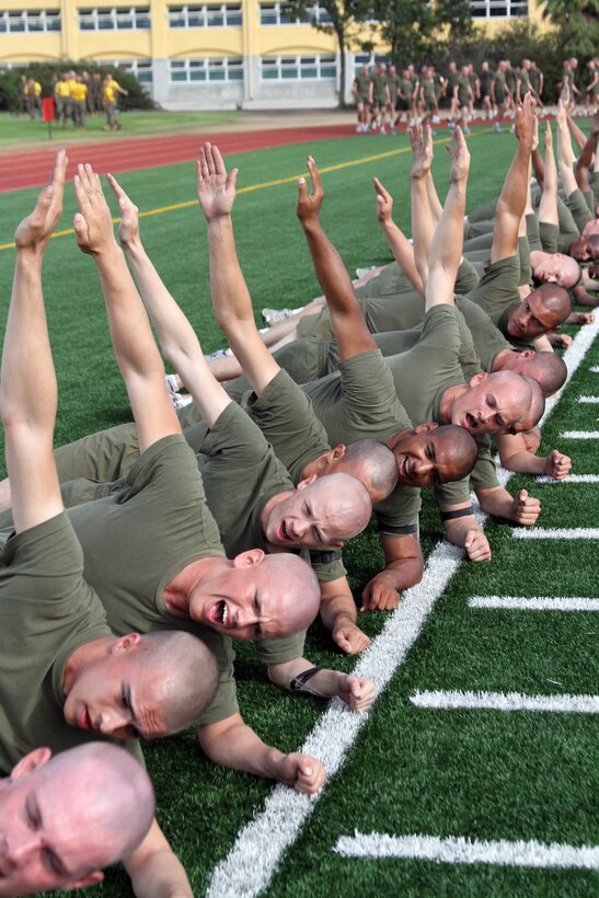Recruits of Company E, 2nd Recruit Training Battalion, plank on their left side during ability groups Oct. 11 aboard Marine Corps Recruit Depot San Diego. Ability groups has specific dynamic exercises that focus on building up strength and endurance.