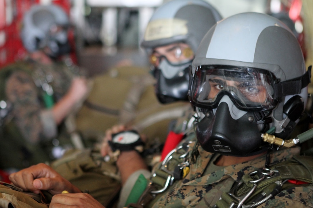 A Marine with Force Reconnaissance Platoon, 31st Marine Expeditionary Unit, waits for the command to stand and parachute out of a C-130 Hercules aircraft while conducting bilateral parachute jumps alongside Philippine Marines and Soldiers, here, Oct. 15. The Marines and Sailors of the 31st MEU are participating in the 29th iteration of the Philippine Bilateral Amphibious Landing Exercise alongside their Philippine Marine counterparts in order to improve the two forces’ interoperability and strengthen their long standing relationship. The 31st MEU is the only continuously forward-deployed MEU and is the Marine Corps’ force in readiness in the Asia-Pacific region.