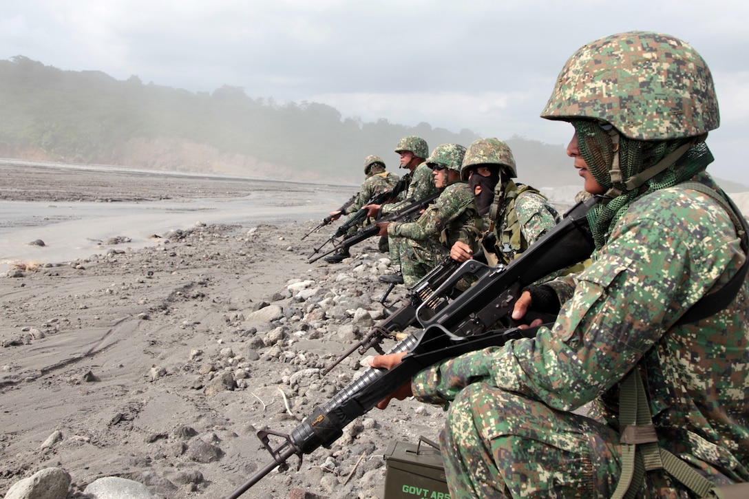 Philippine Marines of the 33rd Battalion, 33rd Marine Company, provide security during a bilateral helicopter raid exercise with the 31st Marine Expeditionary Unit here, Oct. 14. The training was part of the 29th iteration of the annual Philippines Bilateral Amphibious Landing Exercise, designed to increase interoperability between U.S. and Philippine forces while strengthening their long standing bond.
