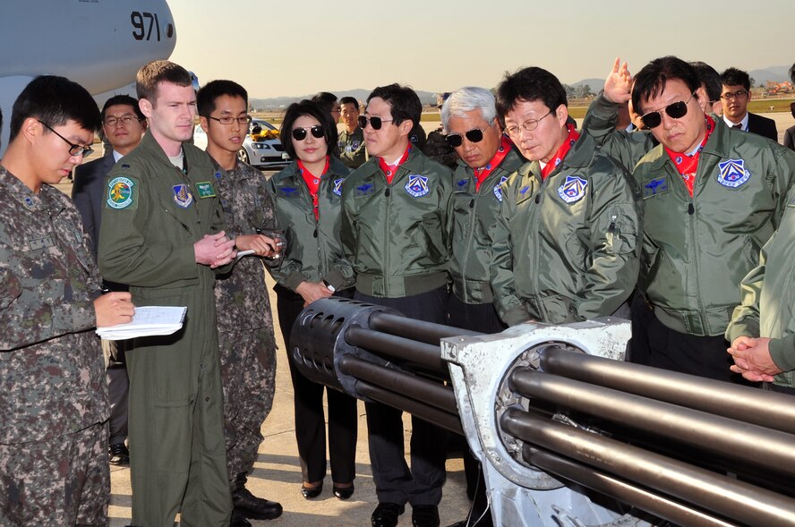 1st Lt. Joseph Curran, 25th Fighter Squadron A-10 Thunderbolt II pilot, explains the capabilities of the 30mm Gatling gun to the National Assembly Defense Committee during a visit to Osan Air Base, Republic of Korea, Oct. 15, 2012.  The assembly members toured static displays of U.S. A-10 Thunderbolt IIs, the U2 Dragon Lady and ROK E-737 Peace Eye, K F-16 Falcon, and F-15K Strike Fighter. (U.S. Air Force photo/Staff Sgt. Craig Cisek)