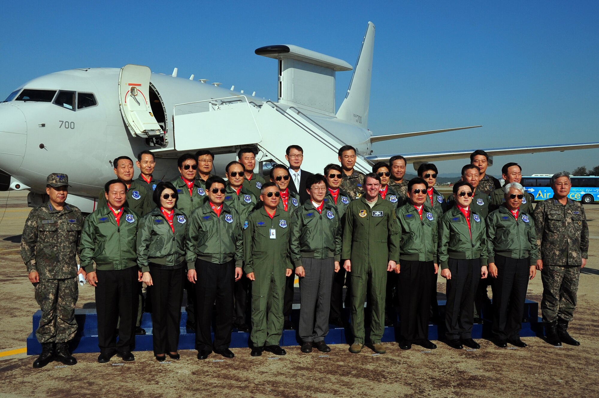 Lt. Gen. Jan-Marc Jouas, 7th Air Force commander, Republic of Korea National Assembly Members and ROK Airmen pose for a group photo in front of a ROK E-737 Peace Eye at Osan Air Base, Oct. 15, 2012. The Peace Eye was on display to demonstrate the capabilities of the combined US- ROK Korea airpower team. (U.S. Air Force photo/Staff Sgt. Craig Cisek)