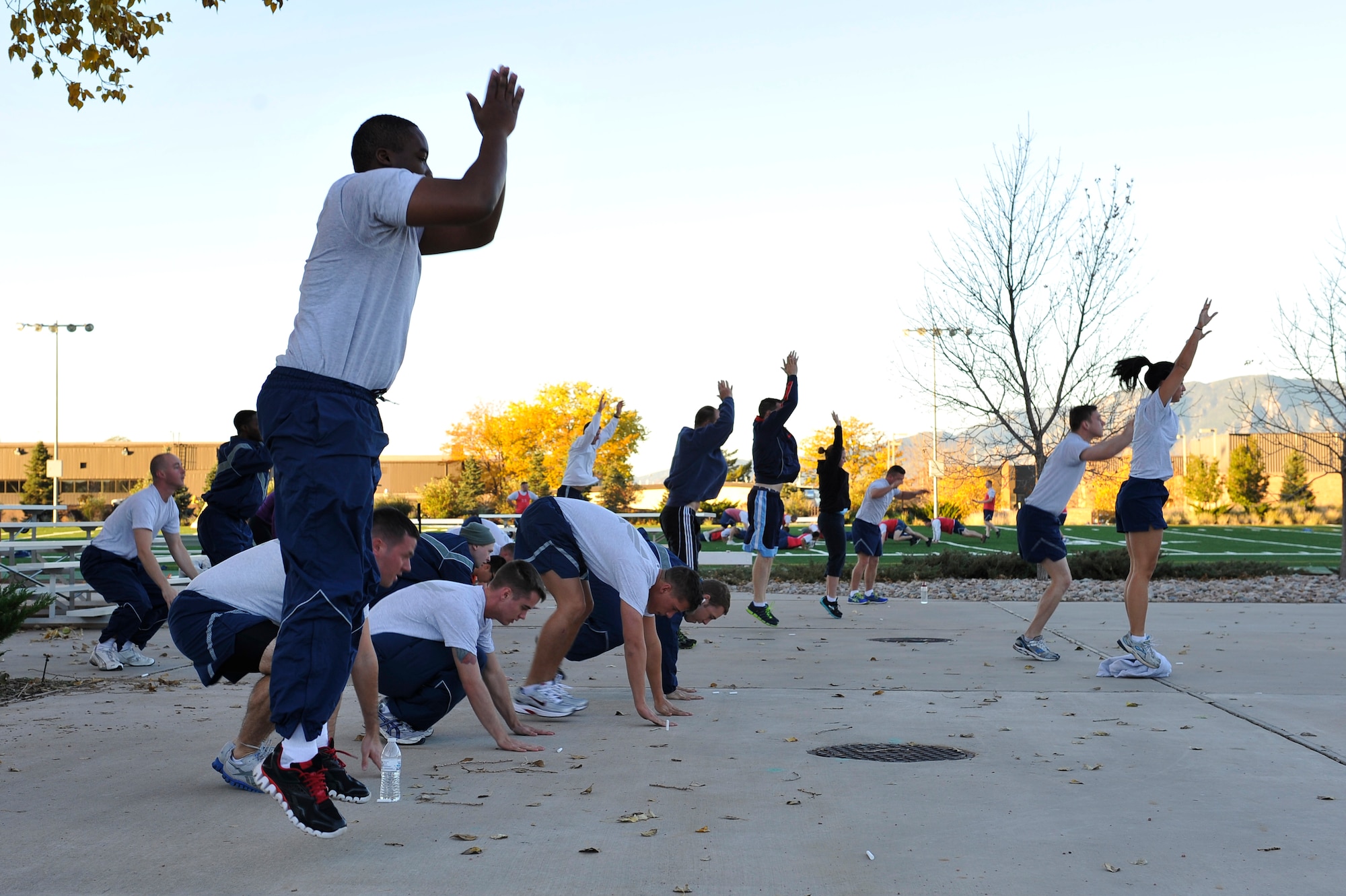 Members of Peterson Air Force Base do "burpees" (an up-down exercise
with a push-up) while participating in the Airman 1st Class LeeBernard E.
Chavis memorial workout Oct. 16.  The workout is an annual event continued
by Chavis' friends world-wide to commemorate his death on Oct. 14, 2006, in
the streets near Baghdad, Iraq.  (U.S. Air Force photo by SSgt Christopher
Boitz)  
