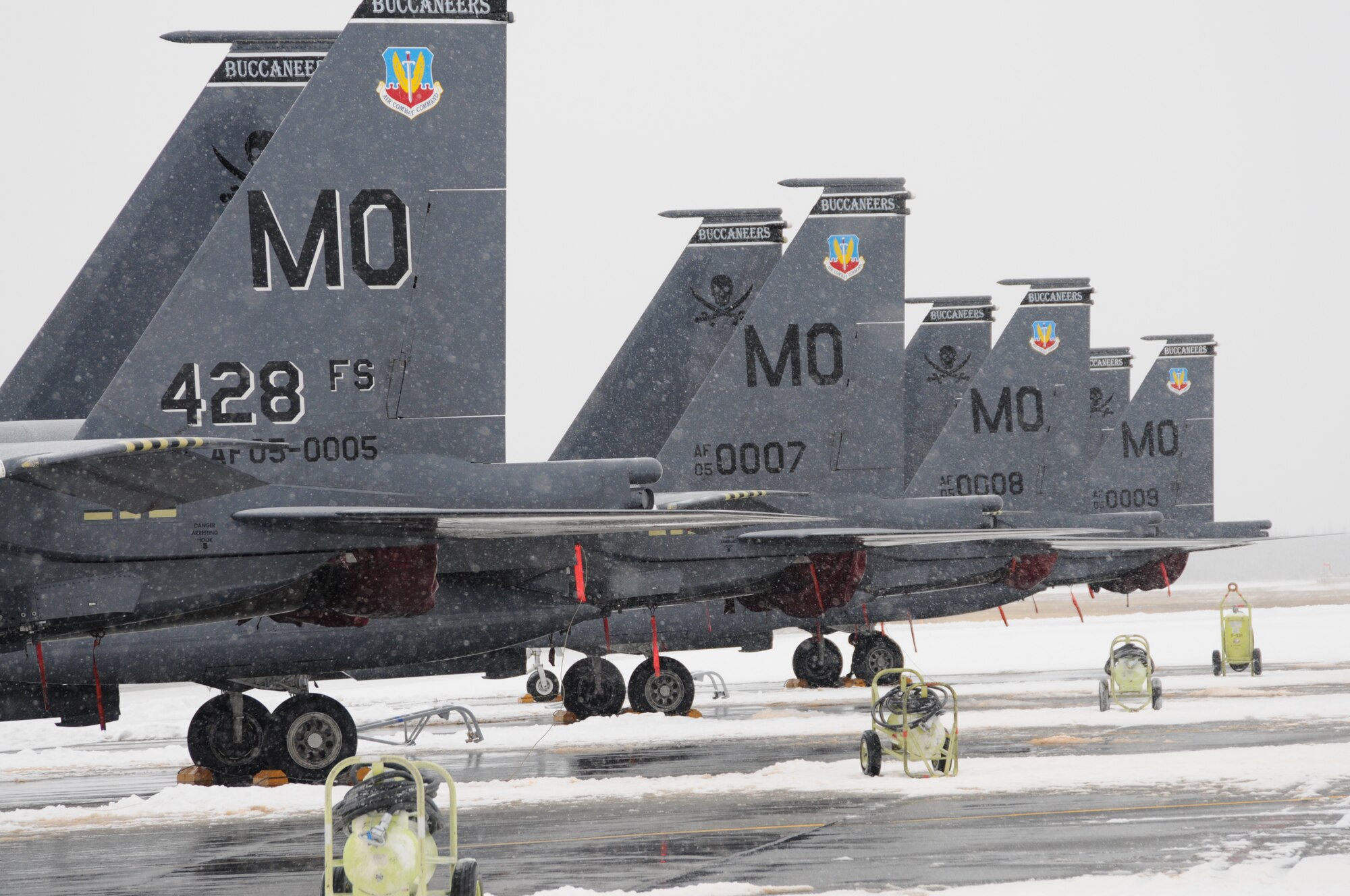 Aircraft assigned to the 428th Fighter Squadron sit on the flight line Oct. 16, 2012, at Eielson Air Force Base, Alaska. Due to safety concerns all flights for the second round of the RED FLAG-Alaska 13-1 exercise were cancelled until the extreme weather passed. (U.S. Air Force photo/Senior Airman Benjamin Sutton/Released) 