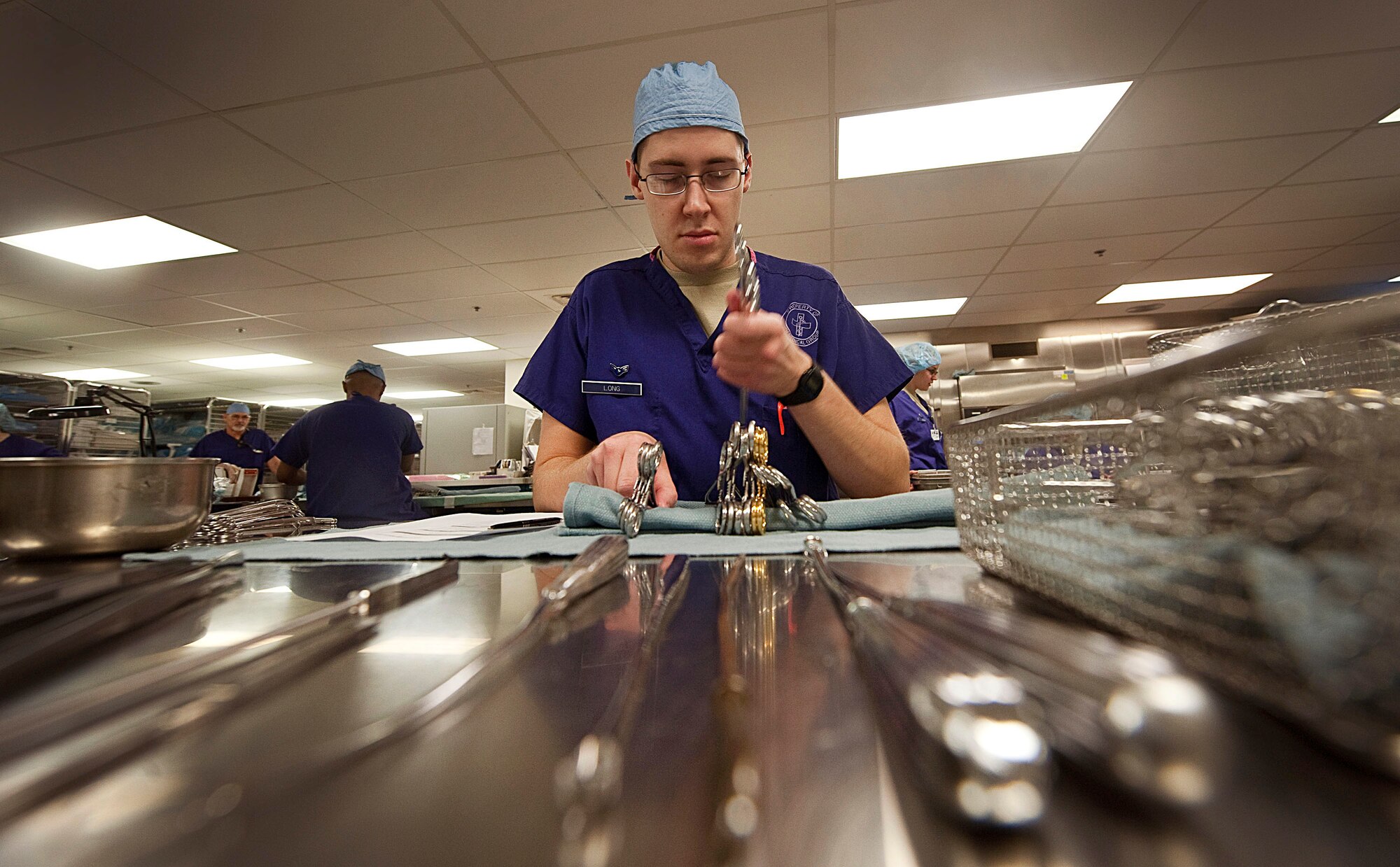 Airman 1st Class Aaron Long, 99th Surgical Operations Squadron surgical technician, assembles a set of surgical instruments at the Mike O' Callaghan Federal Hospital Oct. 11, 2012, at Nellis Air Force Base, Nev. The collective mission of the OR staff is to medically support America's military and authorized DOD and Veteran Affairs beneficiaries with trusted care.  (U.S. Air Force photo by Staff Sgt. Christopher Hubenthal)