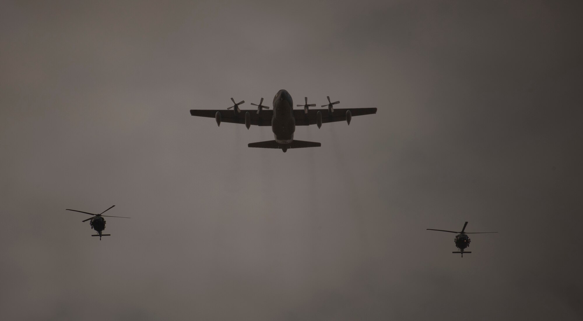 An HC-130P Combat King flanked by two HH-60G Pave Hawks from the 23d Wing fly in formation while training for an upcoming personnel recovery demonstration at the U.S. Air Force Academy, Colo., Oct. 4, 2012. The demonstration was part of a weeklong visit to the Academy in which members of the 23d WG visited with cadets and answered questions about the operational Air Force. (U.S. Air Force photo by Senior Airman Nicholas Benroth/Released)