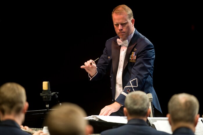 U.S. Air Force Capt.  Jason Plosch, Air Force Band of the Golden West conductor and commander, conducts the band during a concert at the Las Vegas Academy of the Performing Arts Oct. 12, 2012, in Las Vegas, Nev. Plosch conducted the AF Band of the Golden West during a two-hour concert which played a variety of music, including Broadway showtunes, marches and a collection of patriotic numbers. (U.S. Air Force photo by Senior Airman Daniel Hughes)