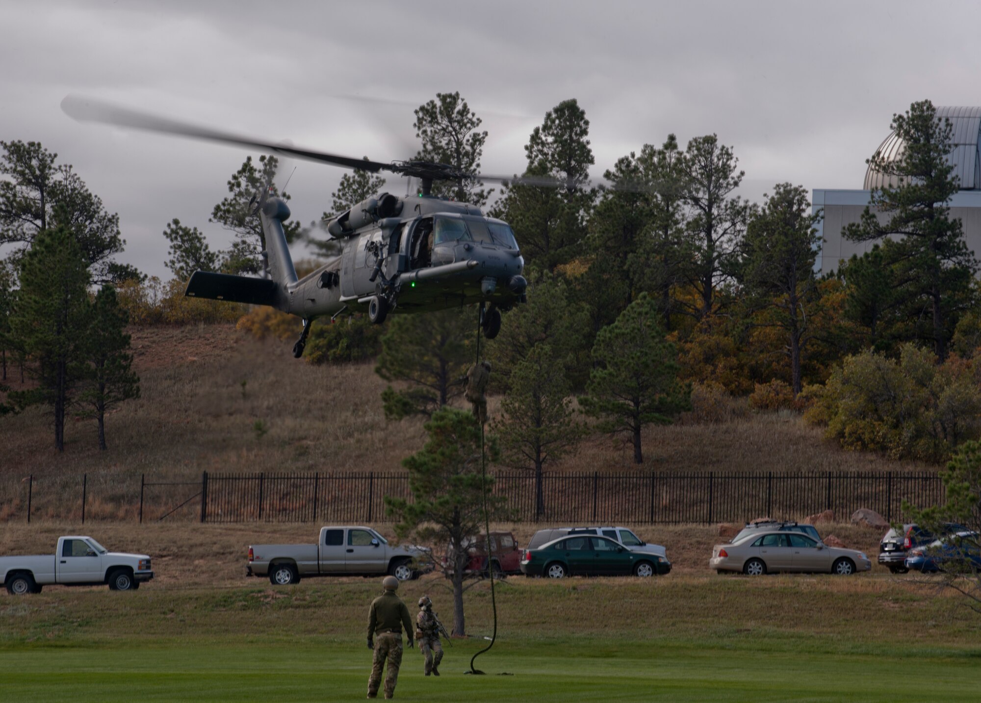 Pararescuemen from the 48th Rescue Squadron rappel down from an HH-60G Pave Hawk during personnel recovery training at the U.S. Air Force Academy, Colo., Oct. 4, 2012. The 563d Rescue Group visited the Academy to help showcase the personnel recovery mission to cadets . (U.S. Air Force photo by Senior Airman Nicholas Benroth/Released)