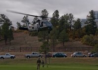 Pararescuemen from the 48th Rescue Squadron rappel down from an HH-60G Pave Hawk during personnel recovery training at the U.S. Air Force Academy, Colo., Oct. 4, 2012. The 563d Rescue Group visited the Academy to help showcase the personnel recovery mission to cadets . (U.S. Air Force photo by Senior Airman Nicholas Benroth/Released)