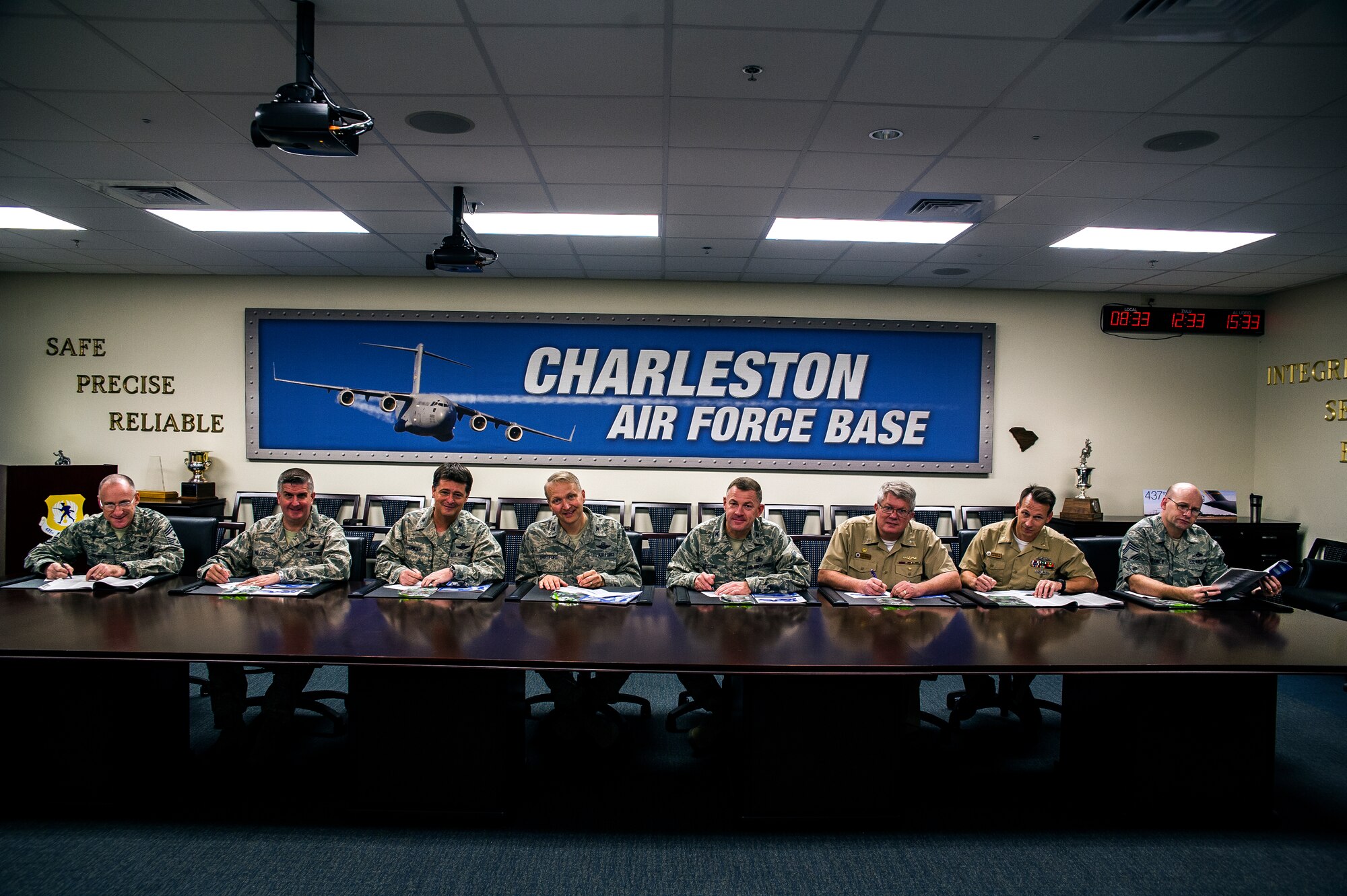 (Left to Right) Chief Master Sgt. Earl Hannon, 628th Air Base Wing command chief, Col. Al Miller, 437th Airlift Wing vice commander, Col. Russell Fingar, 315th AW vice commander, Col. Darren Hartford, 437th AW commander, Col. Richard McComb, Joint Base Charleston commander, Capt. Thomas Bailey, JB Charleston deputy commander, Master Chief Petty Officer Billy Cady, Joint Base Charleston - Weapons Station command master chief and Chief Master Sgt. Andy Komen, 437th AW acting command chief, sign their donation slips for the Combined Federal Campaign Oct. 16, 2012, at Joint Base – Air Base, Charleston, S.C. The CFC will continue through Oct. 31. (U.S. Air Force photo/Airman 1st Class George Goslin)