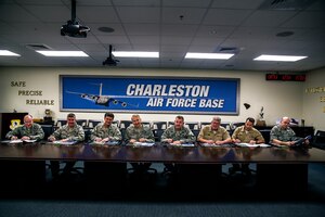 (Left to Right) Chief Master Sgt. Earl Hannon, 628th Air Base Wing command chief, Col. Al Miller, 437th Airlift Wing vice commander, Col. Russell Fingar, 315th AW vice commander, Col. Darren Hartford, 437th AW commander, Col. Richard McComb, Joint Base Charleston commander, Capt. Thomas Bailey, JB Charleston deputy commander, Master Chief Petty Officer Billy Cady, Joint Base Charleston - Weapons Station command master chief and Chief Master Sgt. Andy Komen, 437th AW acting command chief, sign their donation slips for the Combined Federal Campaign Oct. 16, 2012, at Joint Base – Air Base, Charleston, S.C. The CFC will continue through Oct. 31. (U.S. Air Force photo/Airman 1st Class George Goslin)