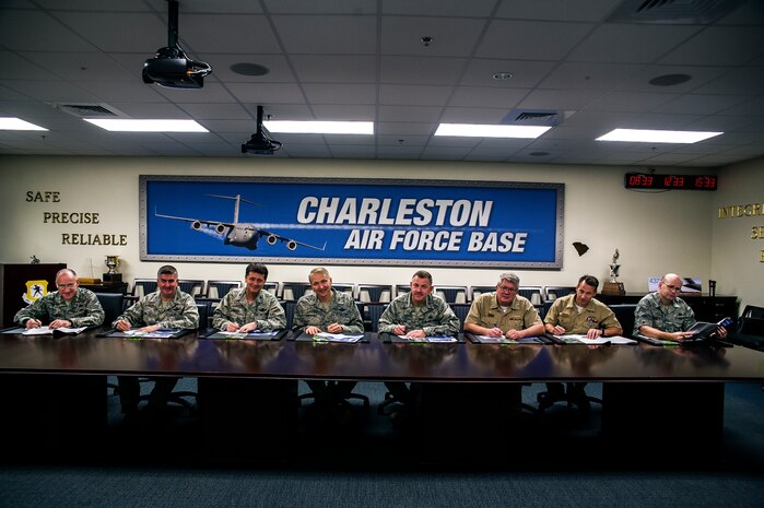 (Left to Right) Chief Master Sgt. Earl Hannon, 628th Air Base Wing command chief, Col. Al Miller, 437th Airlift Wing vice commander, Col. Russell Fingar, 315th AW vice commander, Col. Darren Hartford, 437th AW commander, Col. Richard McComb, Joint Base Charleston commander, Capt. Thomas Bailey, JB Charleston deputy commander, Master Chief Petty Officer Billy Cady, Joint Base Charleston - Weapons Station command master chief and Chief Master Sgt. Andy Komen, 437th AW acting command chief, sign their donation slips for the Combined Federal Campaign Oct. 16, 2012, at Joint Base – Air Base, Charleston, S.C. The CFC will continue through Oct. 31. (U.S. Air Force photo/Airman 1st Class George Goslin)
