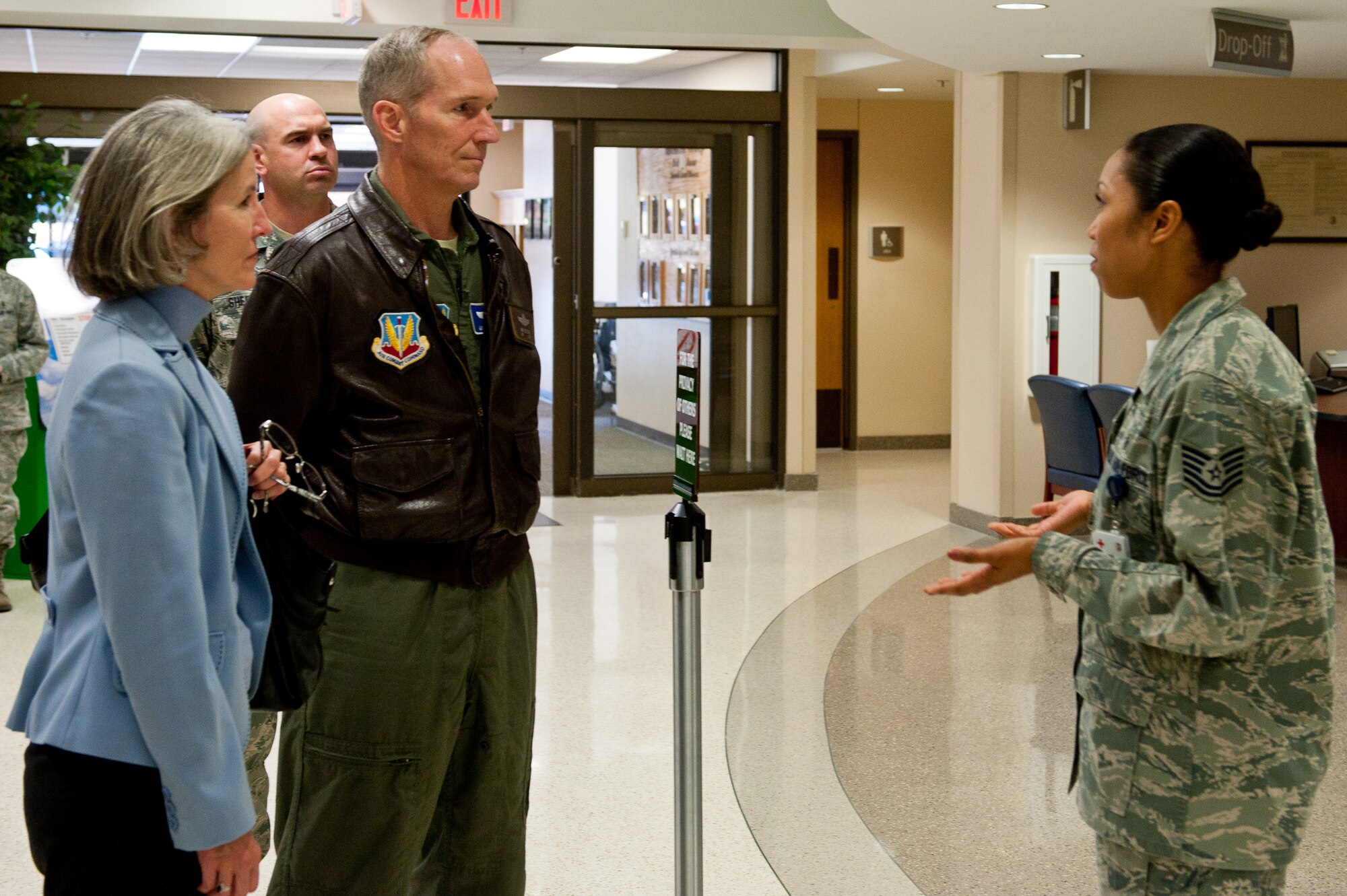 Air Force Tech. Sgt. Sonyea Woolfolk, 28th Medical Support Squadron pharmacy NCO in charge, provides information about pharmacy operations to Gen. Mike Hostage, commander of Air Combat Command, and his wife, Kathy, during their tour of the 28th Medical Group at Ellsworth Air Force Base, S.D., Oct. 10, 2012. Hostage visited Ellsworth to see firsthand the mission being accomplished by the Airmen providing expeditionary combat power. (U.S. Air Force photo by Airmen 1st Class Kate Thornton-Maurer/ Released)