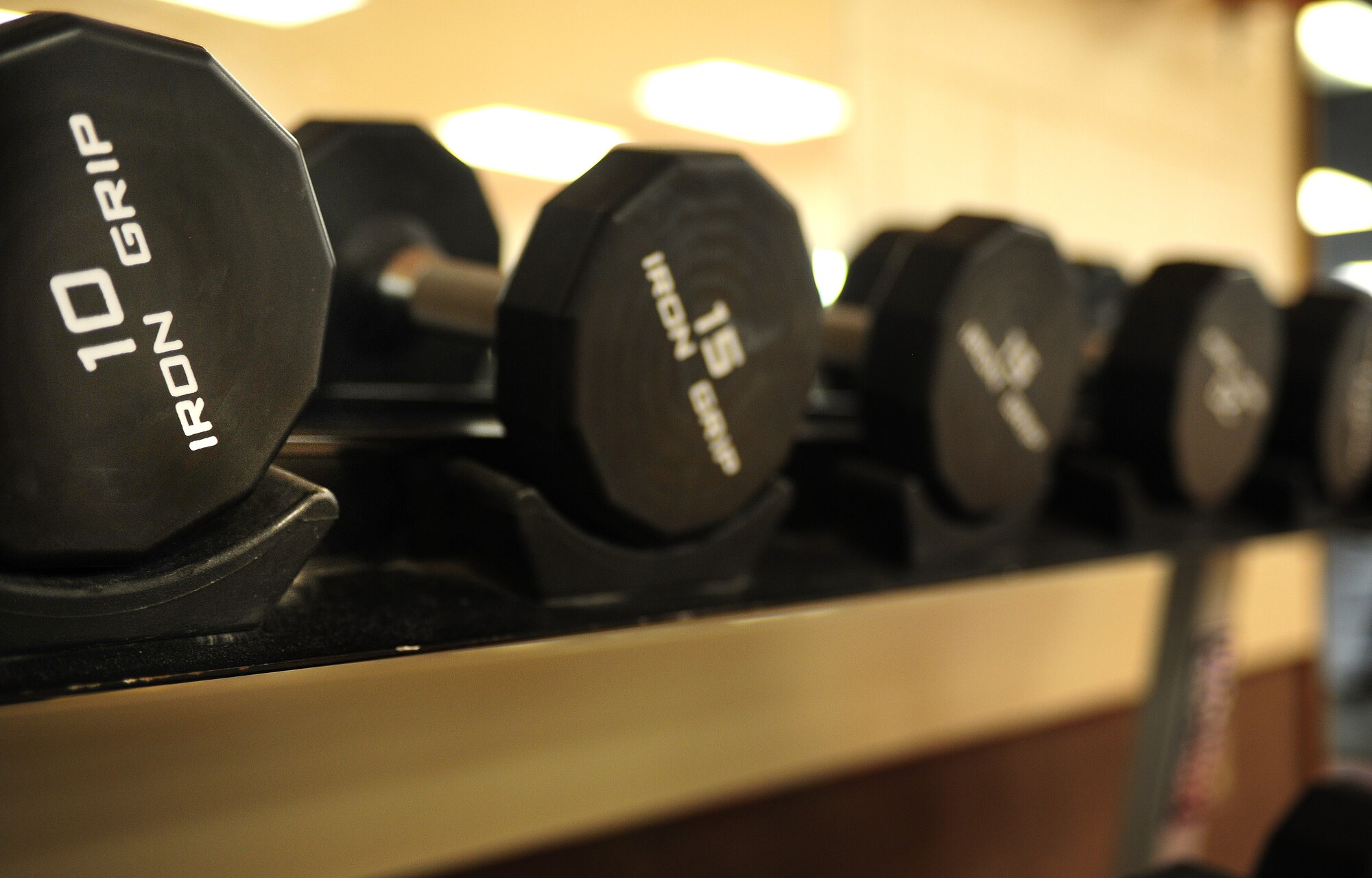Free-range weights sit on a shelf at the Fitness Center at Cannon Air Force Base, N.M., Oct. 15, 2012. The Fitness Center recently remodeled its premises and added better equipment to improve the experience of its patrons. (U.S. Air Force photo/Airman 1st Class Ericka Engblom)