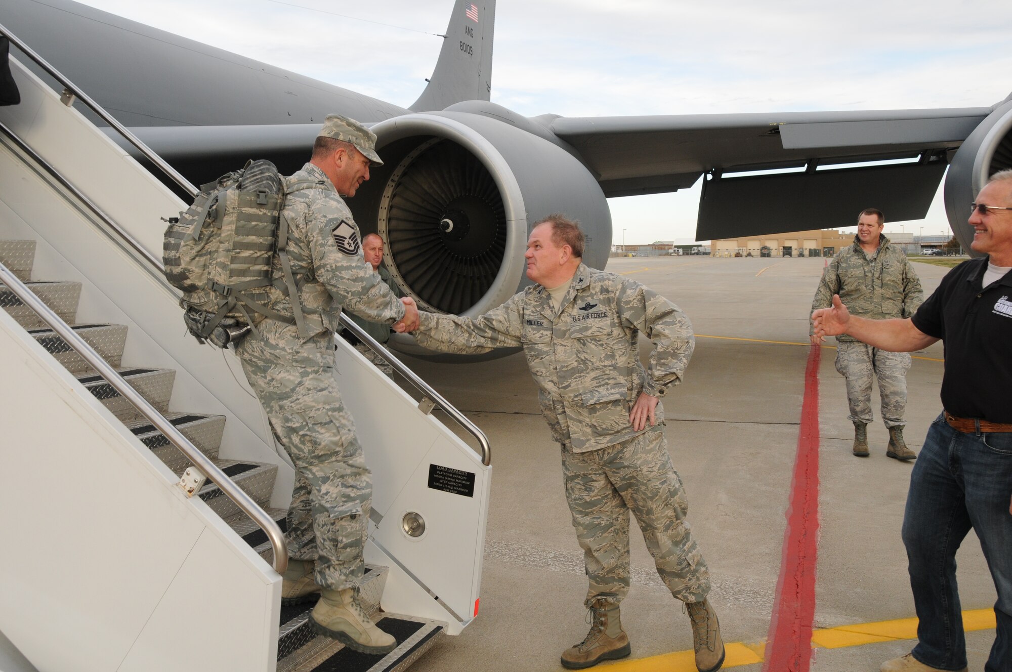 Colonel Brian Miller, Commander of the 185th Air Refueling Wing, Sioux City, Iowa, along with his staff, greets Master Sergeant Michael Loghry and his fellow Security Forces members as they return home after a six month deployment to an undisclosed location in the South-west Asian theater of operations on 17 October 2012. (US Air Force photo by TSgt Brian Cox)