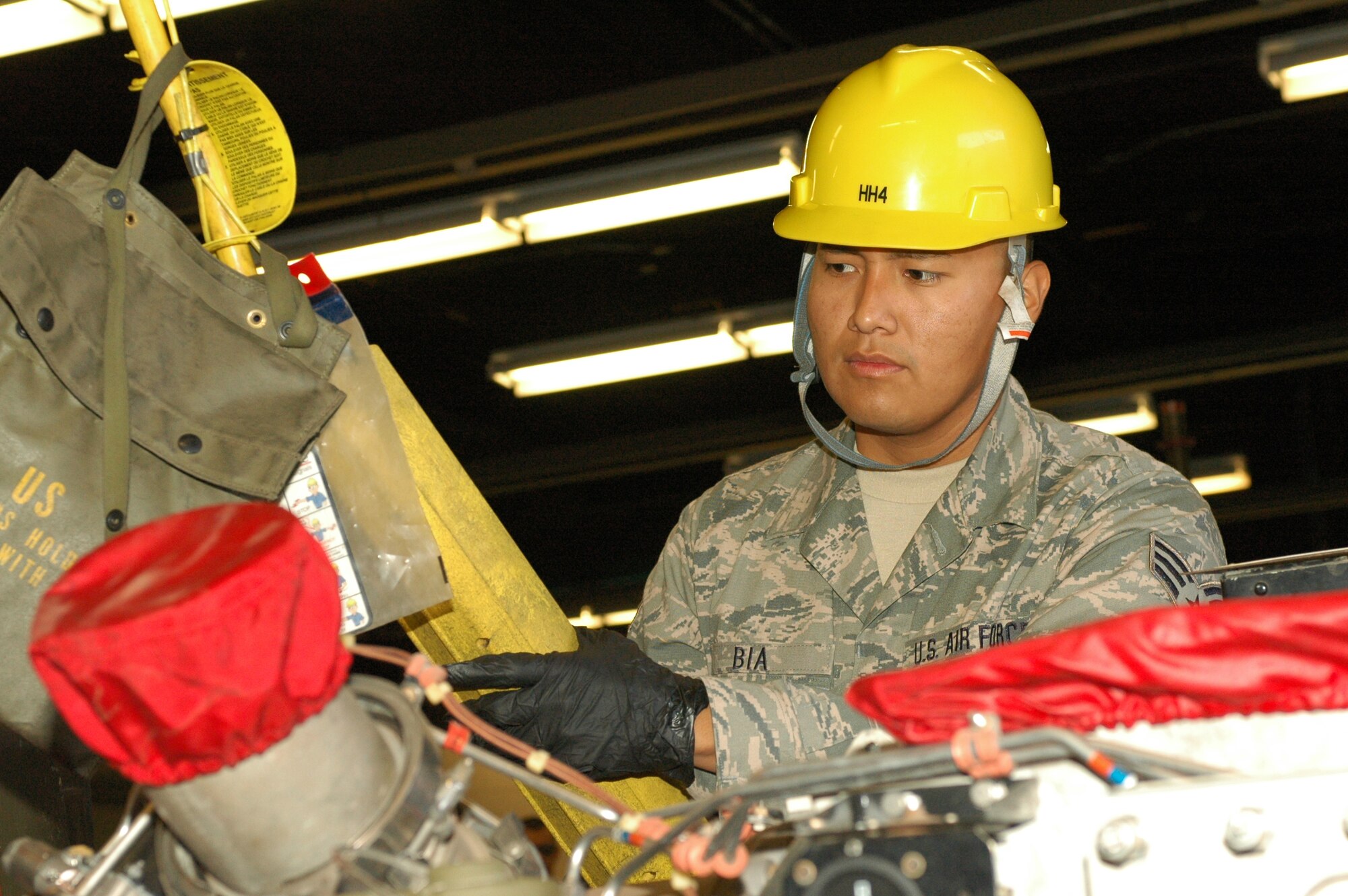 Senior Airman Andre Bia, an Aerospace Ground Equipment technician with the 162nd Fighter Wing, operates a lift to extract an engine from a piece of AGE. (U.S. Air Force photo by Staff Sgt. Heather Davis/Released)