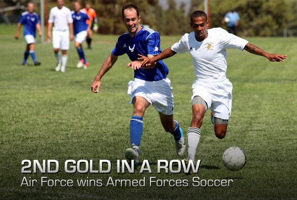 Cpl. Bryant Haskinjames, a foward for the Marine Corps team, fights off a defender as he dribbles toward during the 2012 Armed Force Men's Soccer Tournament at the 11 Area Parade Deck, Sept. 26. The Air Force team defeated the Marine Corps team 2-1, handing the Marines their first loss of the tournament.
