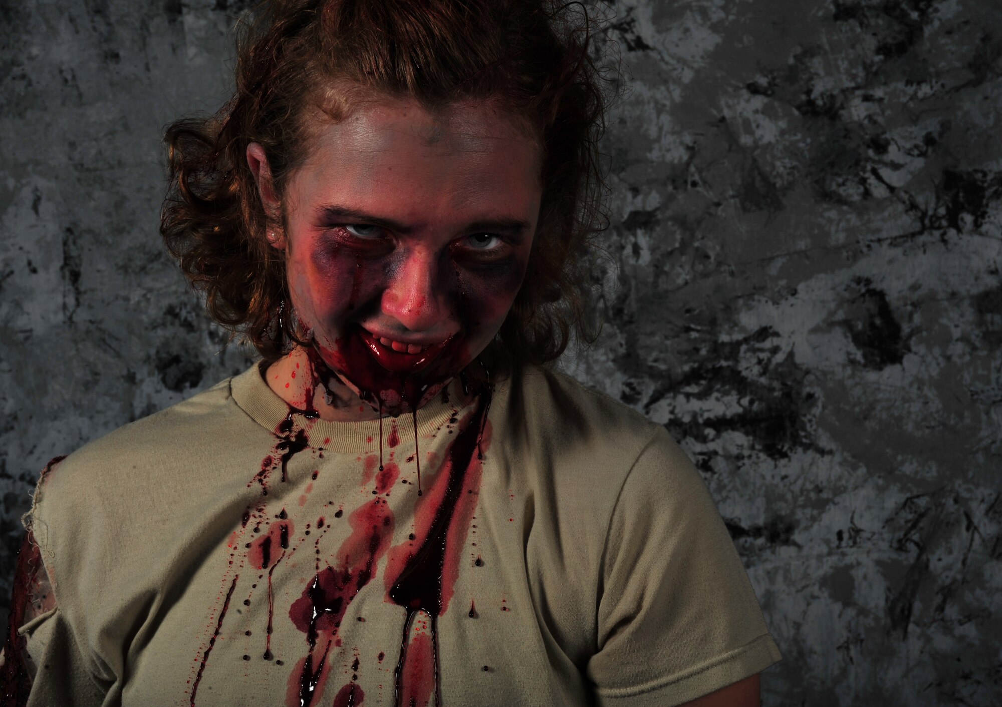 Air Commandos transform into their undead alter egos in preparation for the upcoming Zombie 5K/run obstacle course scheduled to take place at the Whispering Winds Golf Course, Oct. 19, at Cannon Air Force Base, N.M. The event, hosted by Cannon’s Air Force Sergeant’s Association, challenges human runners to navigate a 3.2 mile course while evading the clutches of the zombie horde that will be crawling, lumbering and sprinting after them. (U.S. Air Force illustration/Airman 1st Class Ericka Engblom)