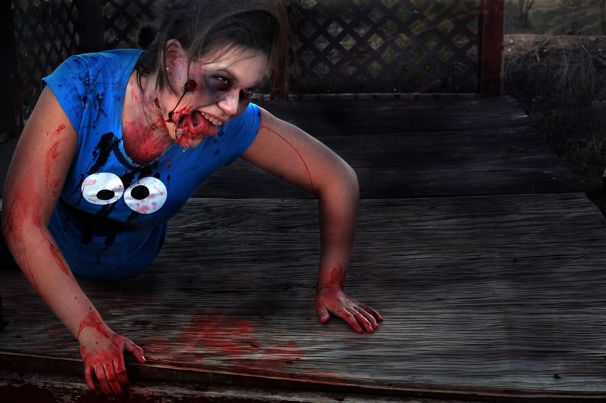 Air Commandos transform into their undead alter egos in preparation for the upcoming Zombie 5K/run obstacle course scheduled to take place at the Whispering Winds Golf Course, Oct. 19, at Cannon Air Force Base, N.M. The event, hosted by Cannon's Air Force Sergeant's Association, challenges human runners to navigate a 3.2 mile course while evading the clutches of the zombie horde that will be crawling, lumbering and sprinting after them. (U.S. Air Force illustration/Senior Airman Jette Carr)