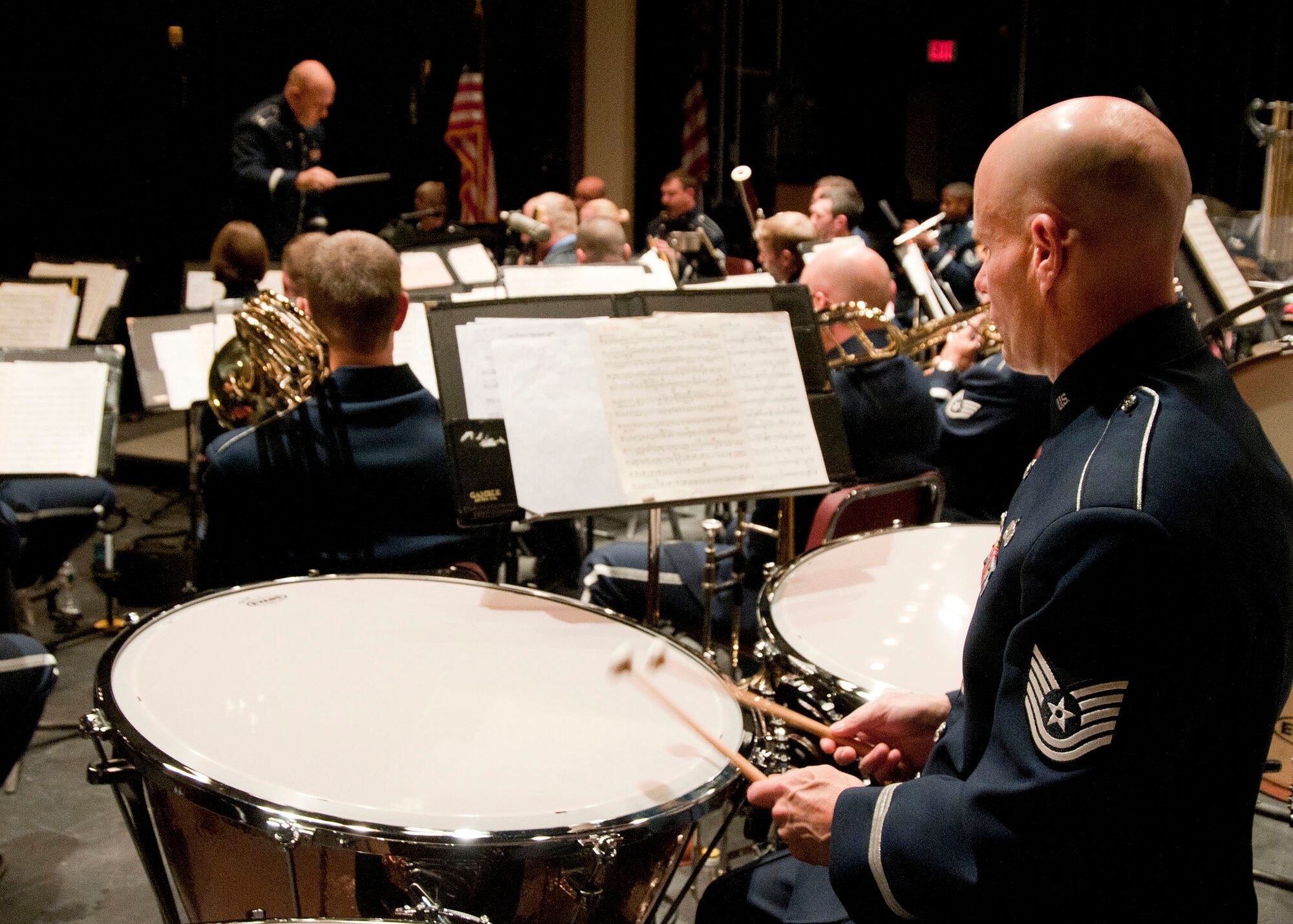 NASHUA, N.H. -- Tech. Sgt. Charles Lawyer, U.S. Air Force Band of Liberty perssionist, performs on the tympani during an evening concert at the Keefe Auditorium here Oct. 13 as Capt. David Alpar, U. S. Air Force Band of Liberty commander, conducts. The Band of Liberty Concert Band is a select group of profesional Airmen musicians who support the global Air Force mission by providing musical products and services for official military, recruiting, and community relations events. (U.S. Air Force photo by Mark Wyatt)