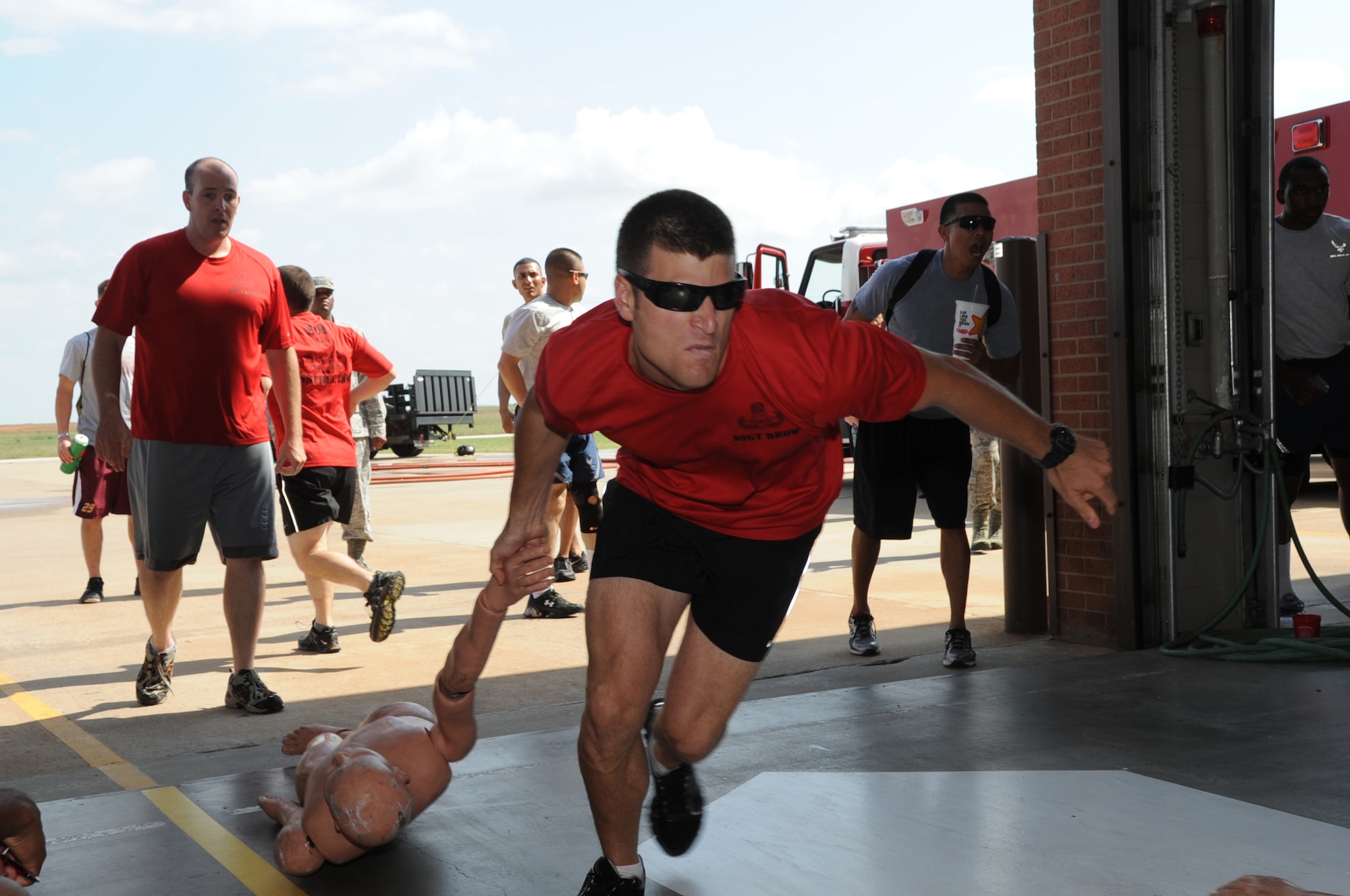 EOD Preliminary School instructors from the 366th Training Squadron participate in the dummy drag event Oct. 12, 2012, at the 3rd annual Fire Prevention Olympics. The event was hosted by the Sheppard Air Force Base fire department as part of Fire Prevention week.  (US Air Force photo/Felton Joshua Jr.)