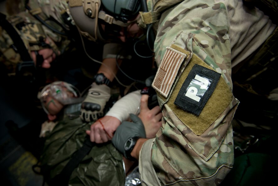 U.S. Air Force pararesuemen from the 38th Rescue Squadron perform simulated medical procedures at Moody Air Force Base, Ga., Oct. 5, 2012. The pararescuemen communicated with the patient to ensure he remained awake and responsive. (U.S. Air Force photo by Senior Airman Douglas Ellis/Released)
