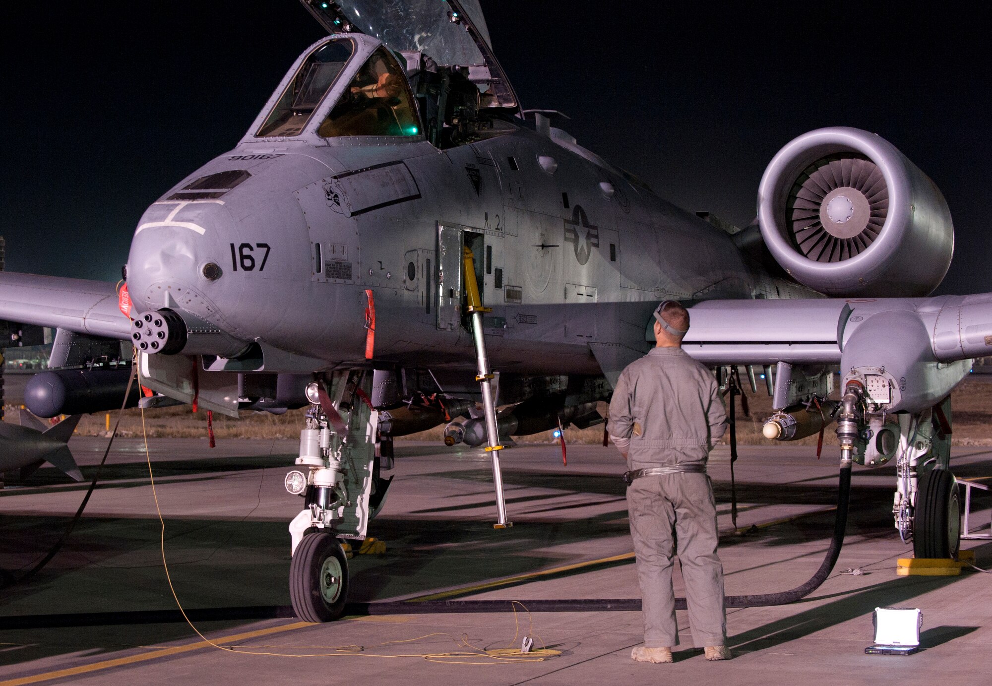Two aircraft maintainers assigned to the 455th Expeditionary Aircraft Maintenance Squadron perform a pre-mission inspection on an A-10 Thunderbolt II at Bagram Airfield, Afghanistan, Oct. 17, 2012. The A-10 is part of a squadron of “Warthogs” that recently arrived from Davis-Monthan Air Force Base, Az., to fly missions in support of American and coalition forces here in Afghanistan. (U.S. Air Force photo/SSgt Jeff Nevison)