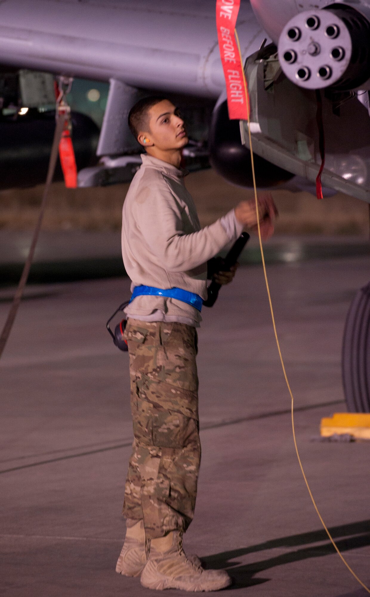An aircraft maintainer assigned to the 455th Expeditionary Aircraft Maintenance Squadron performs a pre-mission inspection on an A-10 Thunderbolt II at Bagram Airfield, Afghanistan, Oct. 17, 2012. The A-10 is part of a squadron of “Warthogs” that recently arrived from Davis-Monthan Air Force Base, Az., to fly missions in support of American and coalition forces here in Afghanistan. (U.S. Air Force photo/SSgt Jeff Nevison)
